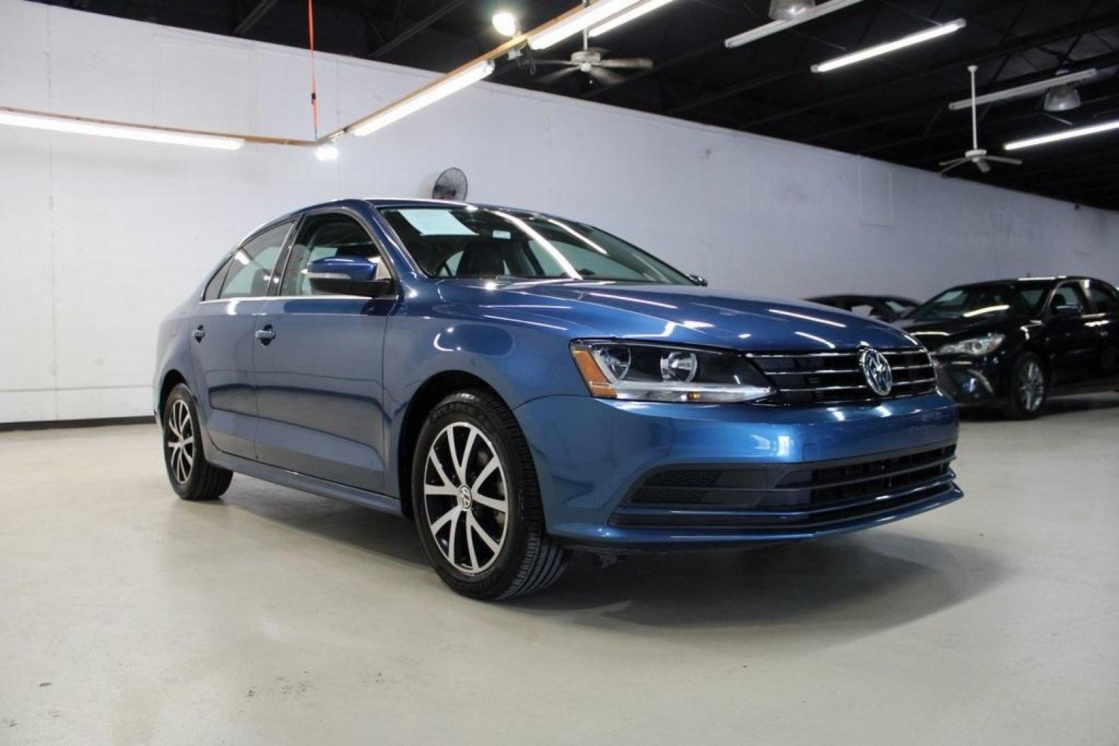 2017 Silk Blue Metallic Volkswagen Jetta 1.4T SE (3VWDB7AJXHM) with an 1.4L TSI engine, Automatic transmission, located at 15300 Midway Rd., Addison, TX, 75001, (972) 702-0011, 32.958321, -96.838074 - HOME OF THE NO HAGGLE PRICE - WHOLESALE PRICES TO THE PUBLIC!!<br><br>Blue 2017 Volkswagen Jetta 1.4T SE<br><br>Recent Arrival! 28/38 City/Highway MPG<br><br>Awards:<br> * 2017 IIHS Top Safety Pick+ * 2017 KBB.com 10 Coolest New Cars Under $18,000 * 2017 KBB.com 10 Best Used Compact Cars Under - Photo#1