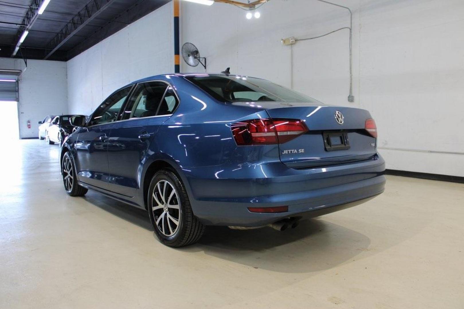 2017 Silk Blue Metallic Volkswagen Jetta 1.4T SE (3VWDB7AJXHM) with an 1.4L TSI engine, Automatic transmission, located at 15300 Midway Rd., Addison, TX, 75001, (972) 702-0011, 32.958321, -96.838074 - HOME OF THE NO HAGGLE PRICE - WHOLESALE PRICES TO THE PUBLIC!!<br><br>Blue 2017 Volkswagen Jetta 1.4T SE<br><br>Recent Arrival! 28/38 City/Highway MPG<br><br>Awards:<br> * 2017 IIHS Top Safety Pick+ * 2017 KBB.com 10 Coolest New Cars Under $18,000 * 2017 KBB.com 10 Best Used Compact Cars Under - Photo#3