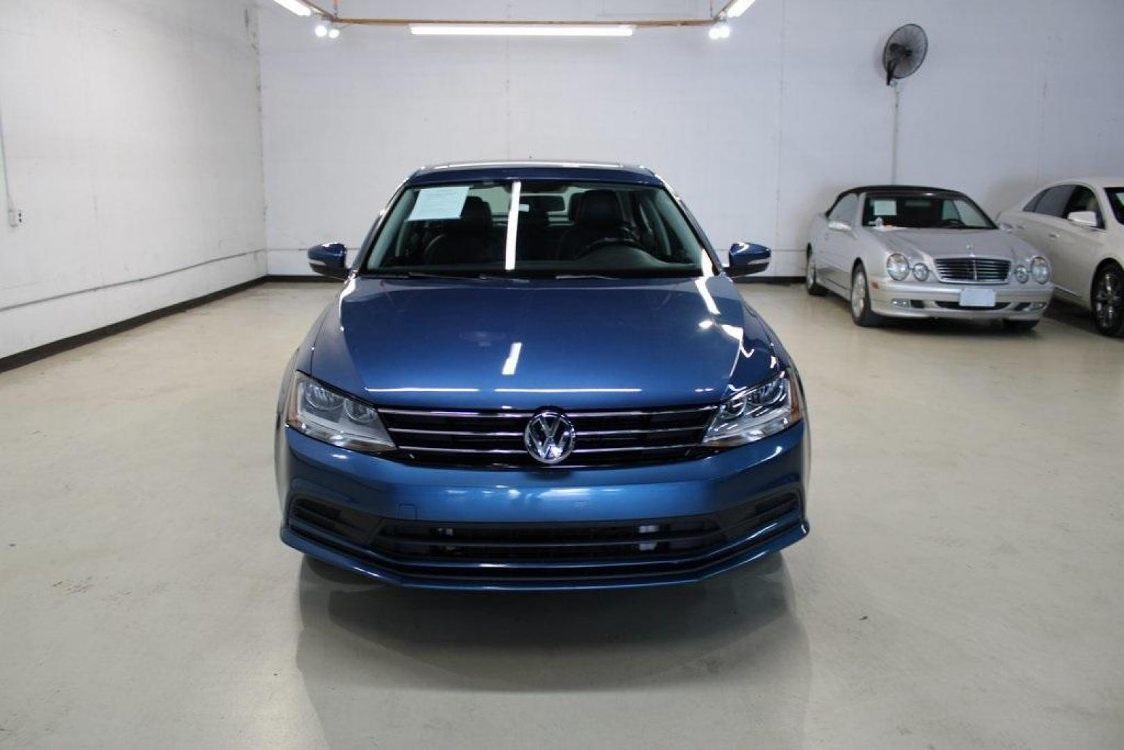 2017 Silk Blue Metallic Volkswagen Jetta 1.4T SE (3VWDB7AJXHM) with an 1.4L TSI engine, Automatic transmission, located at 15300 Midway Rd., Addison, TX, 75001, (972) 702-0011, 32.958321, -96.838074 - HOME OF THE NO HAGGLE PRICE - WHOLESALE PRICES TO THE PUBLIC!!<br><br>Blue 2017 Volkswagen Jetta 1.4T SE<br><br>Recent Arrival! 28/38 City/Highway MPG<br><br>Awards:<br> * 2017 IIHS Top Safety Pick+ * 2017 KBB.com 10 Coolest New Cars Under $18,000 * 2017 KBB.com 10 Best Used Compact Cars Under - Photo#5