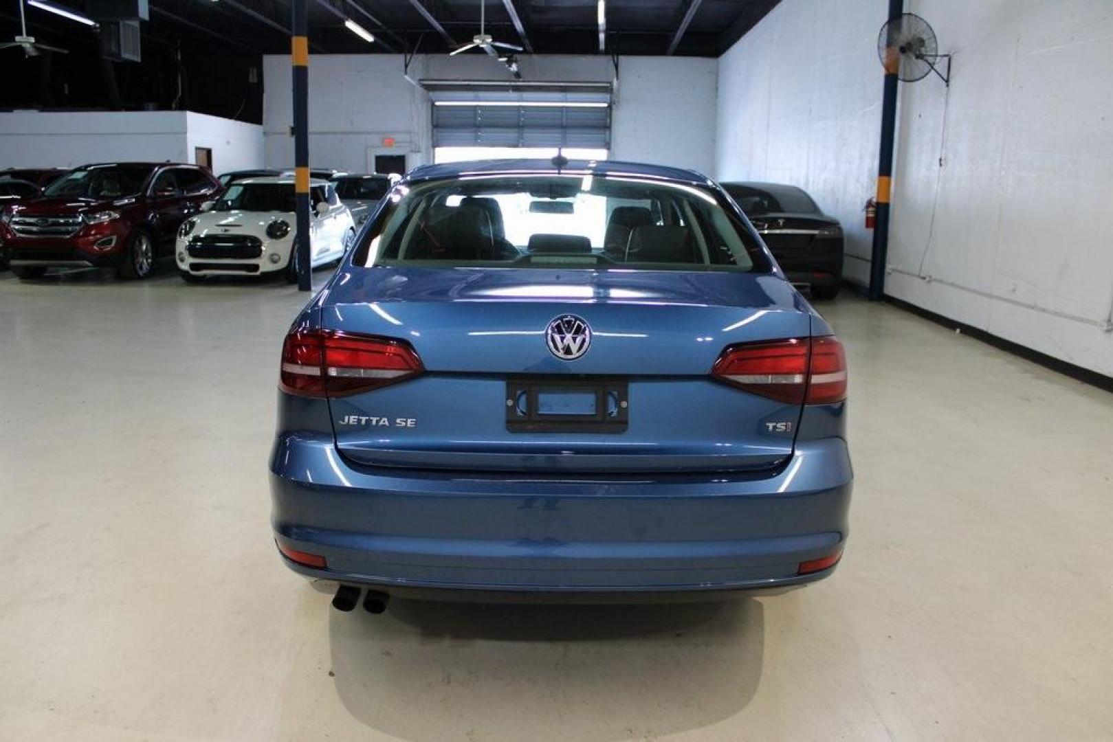 2017 Silk Blue Metallic Volkswagen Jetta 1.4T SE (3VWDB7AJXHM) with an 1.4L TSI engine, Automatic transmission, located at 15300 Midway Rd., Addison, TX, 75001, (972) 702-0011, 32.958321, -96.838074 - HOME OF THE NO HAGGLE PRICE - WHOLESALE PRICES TO THE PUBLIC!!<br><br>Blue 2017 Volkswagen Jetta 1.4T SE<br><br>Recent Arrival! 28/38 City/Highway MPG<br><br>Awards:<br> * 2017 IIHS Top Safety Pick+ * 2017 KBB.com 10 Coolest New Cars Under $18,000 * 2017 KBB.com 10 Best Used Compact Cars Under - Photo#7