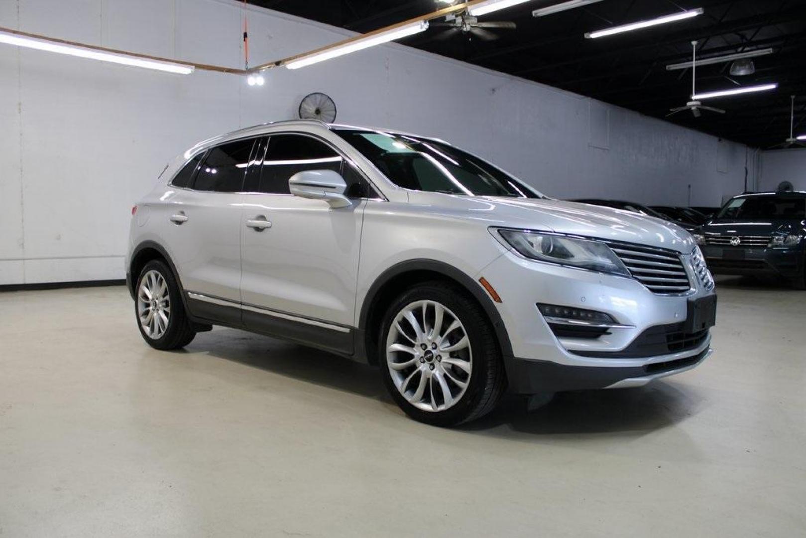 2015 Silver /Island Lincoln MKC Base (5LMCJ1A90FU) with an EcoBoost 2.0L I4 GTDi DOHC Turbocharged VCT engine, Automatic transmission, located at 15300 Midway Rd., Addison, TX, 75001, (972) 702-0011, 32.958321, -96.838074 - HOME OF THE NO HAGGLE PRICE - WHOLESALE PRICES TO THE PUBLIC!! ABS brakes, Alloy wheels, Compass, Electronic Stability Control, Front dual zone A/C, Heated door mirrors, Heated front seats, Illuminated entry, Low tire pressure warning, Remote keyless entry, Traction control.<br><br>Silver 2015 Linco - Photo#6