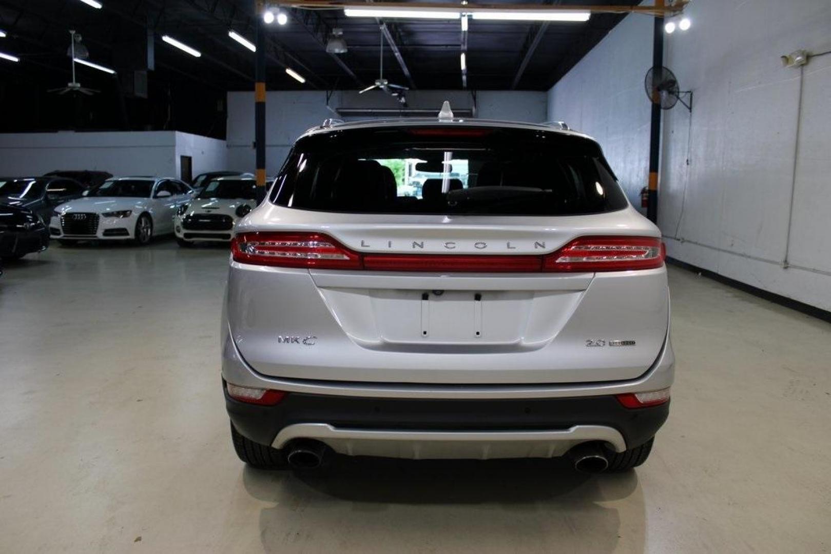 2015 Silver /Island Lincoln MKC Base (5LMCJ1A90FU) with an EcoBoost 2.0L I4 GTDi DOHC Turbocharged VCT engine, Automatic transmission, located at 15300 Midway Rd., Addison, TX, 75001, (972) 702-0011, 32.958321, -96.838074 - HOME OF THE NO HAGGLE PRICE - WHOLESALE PRICES TO THE PUBLIC!! ABS brakes, Alloy wheels, Compass, Electronic Stability Control, Front dual zone A/C, Heated door mirrors, Heated front seats, Illuminated entry, Low tire pressure warning, Remote keyless entry, Traction control.<br><br>Silver 2015 Linco - Photo#7