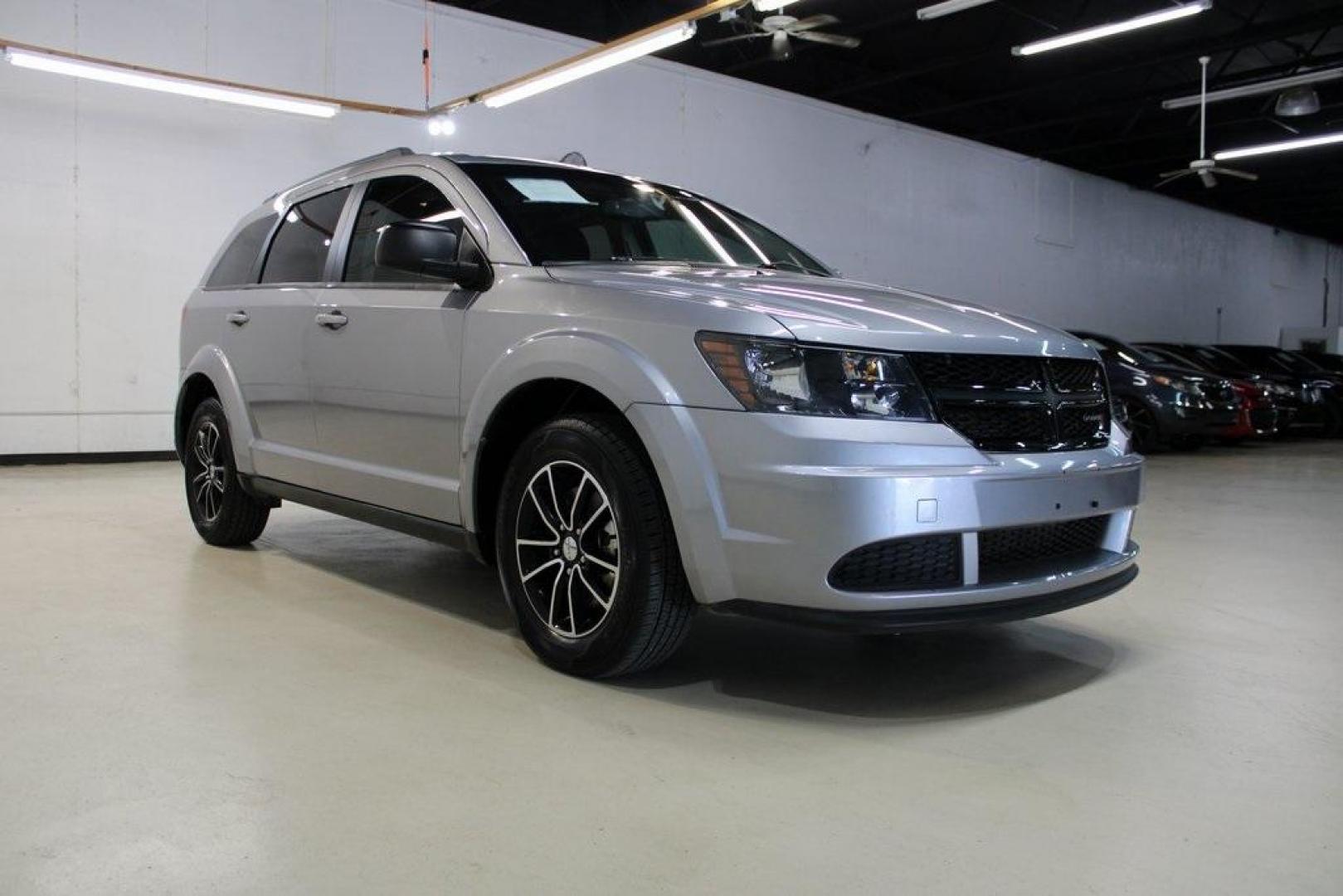 2017 Billet Clearcoat /Black Dodge Journey SE (3C4PDCAB8HT) with an 2.4L I4 DOHC 16V Dual VVT engine, Automatic transmission, located at 15300 Midway Rd., Addison, TX, 75001, (972) 702-0011, 32.958321, -96.838074 - HOME OF THE NO HAGGLE PRICE - WHOLESALE PRICES TO THE PUBLIC!! Journey SE, 4D Sport Utility, 2.4L I4 DOHC 16V Dual VVT, 4-Speed Automatic VLP, FWD, Billet Clearcoat, Black Cloth.<br><br>Billet Clearcoat 2017 Dodge Journey SE<br><br><br>At Midway Auto Group, we strive to provide you with the best qua - Photo#1