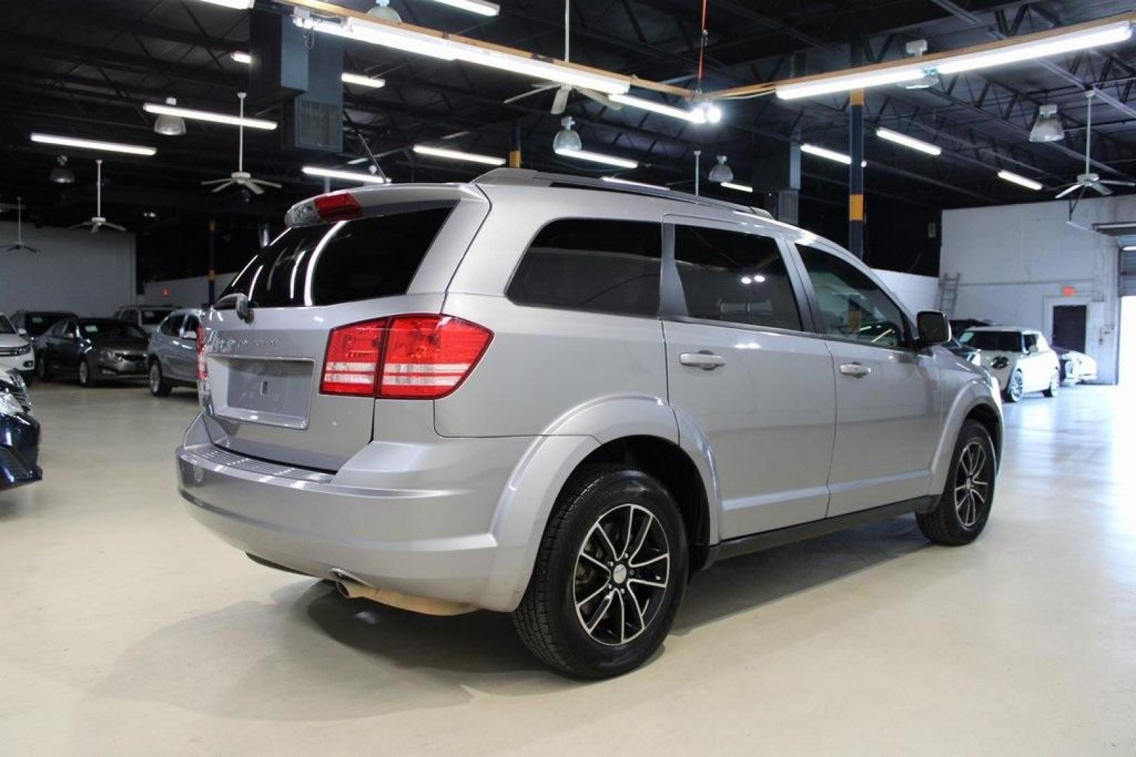 2017 Billet Clearcoat /Black Dodge Journey SE (3C4PDCAB8HT) with an 2.4L I4 DOHC 16V Dual VVT engine, Automatic transmission, located at 15300 Midway Rd., Addison, TX, 75001, (972) 702-0011, 32.958321, -96.838074 - HOME OF THE NO HAGGLE PRICE - WHOLESALE PRICES TO THE PUBLIC!! Journey SE, 4D Sport Utility, 2.4L I4 DOHC 16V Dual VVT, 4-Speed Automatic VLP, FWD, Billet Clearcoat, Black Cloth.<br><br>Billet Clearcoat 2017 Dodge Journey SE<br><br><br>At Midway Auto Group, we strive to provide you with the best qua - Photo#2