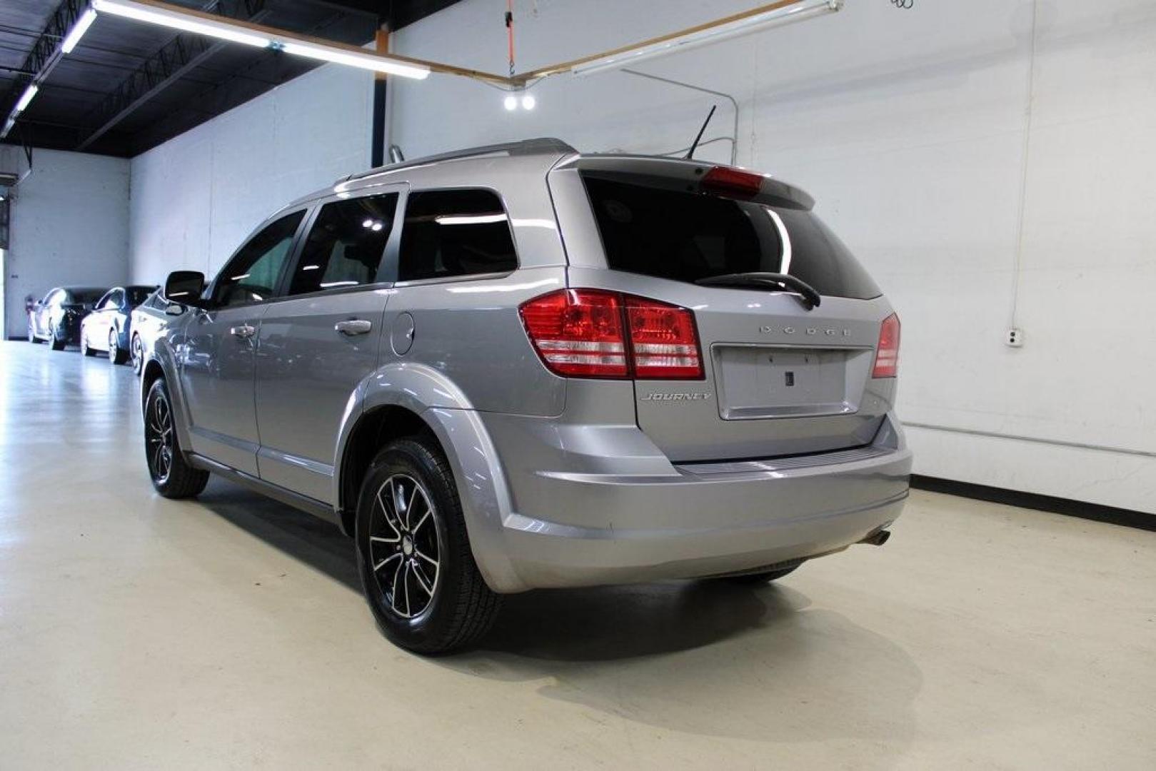 2017 Billet Clearcoat /Black Dodge Journey SE (3C4PDCAB8HT) with an 2.4L I4 DOHC 16V Dual VVT engine, Automatic transmission, located at 15300 Midway Rd., Addison, TX, 75001, (972) 702-0011, 32.958321, -96.838074 - HOME OF THE NO HAGGLE PRICE - WHOLESALE PRICES TO THE PUBLIC!! Journey SE, 4D Sport Utility, 2.4L I4 DOHC 16V Dual VVT, 4-Speed Automatic VLP, FWD, Billet Clearcoat, Black Cloth.<br><br>Billet Clearcoat 2017 Dodge Journey SE<br><br><br>At Midway Auto Group, we strive to provide you with the best qua - Photo#3