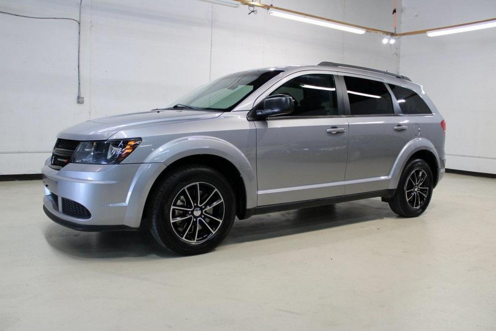 2017 Billet Clearcoat /Black Dodge Journey SE (3C4PDCAB8HT) with an 2.4L I4 DOHC 16V Dual VVT engine, Automatic transmission, located at 15300 Midway Rd., Addison, TX, 75001, (972) 702-0011, 32.958321, -96.838074 - HOME OF THE NO HAGGLE PRICE - WHOLESALE PRICES TO THE PUBLIC!! Journey SE, 4D Sport Utility, 2.4L I4 DOHC 16V Dual VVT, 4-Speed Automatic VLP, FWD, Billet Clearcoat, Black Cloth.<br><br>Billet Clearcoat 2017 Dodge Journey SE<br><br><br>At Midway Auto Group, we strive to provide you with the best qua - Photo#4