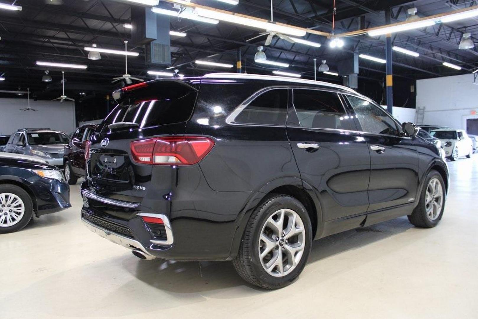 2020 Ebony Black /Black Kia Sorento SX (5XYPKDA56LG) with an V6 engine, Automatic transmission, located at 15300 Midway Rd., Addison, TX, 75001, (972) 702-0011, 32.958321, -96.838074 - HOME OF THE NO HAGGLE PRICE - WHOLESALE PRICES TO THE PUBLIC!! Bluetooth, Hands Free Connectivity, Navigation, Premium Audio, 3rd Row Seat, Backup Camera, Leather Seats, Premium Wheels, Sunroof / Moonroof, non smoker, Sorento SX, 4D Sport Utility, V6, 8-Speed Automatic, AWD, Ebony Black, Black Leath - Photo#2