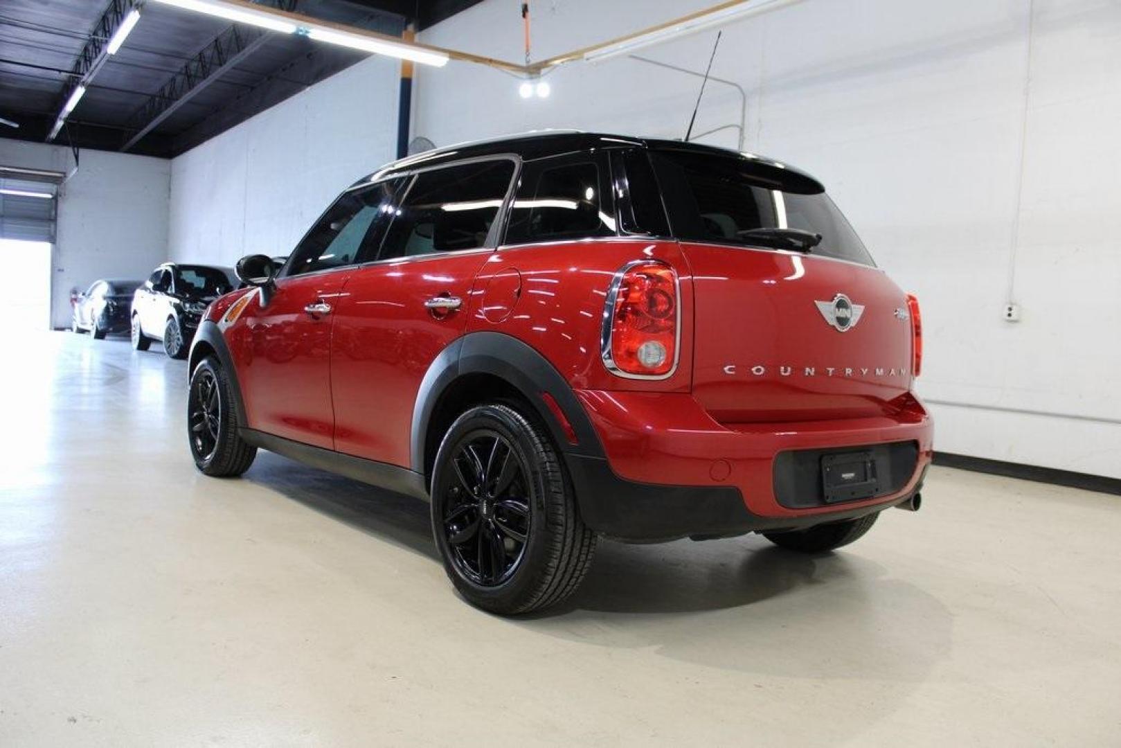 2015 Blazing Red /Carbon Black Gravity MINI Cooper Countryman Base (WMWZB3C51FW) with an 1.6L I4 DOHC 16V engine, Automatic transmission, located at 15300 Midway Rd., Addison, TX, 75001, (972) 702-0011, 32.958321, -96.838074 - HOME OF THE NO HAGGLE PRICE - WHOLESALE PRICES TO THE PUBLIC!! 4D Sport Utility, 1.6L I4 DOHC 16V, 6-Speed Automatic Steptronic, FWD, Blazing Red, Carbon Black Gravity Leather.<br><br>Blazing Red 2015 MINI Cooper Countryman<br><br>Recent Arrival! 25/30 City/Highway MPG<br><br>Awards:<br> * JD Power - Photo#3