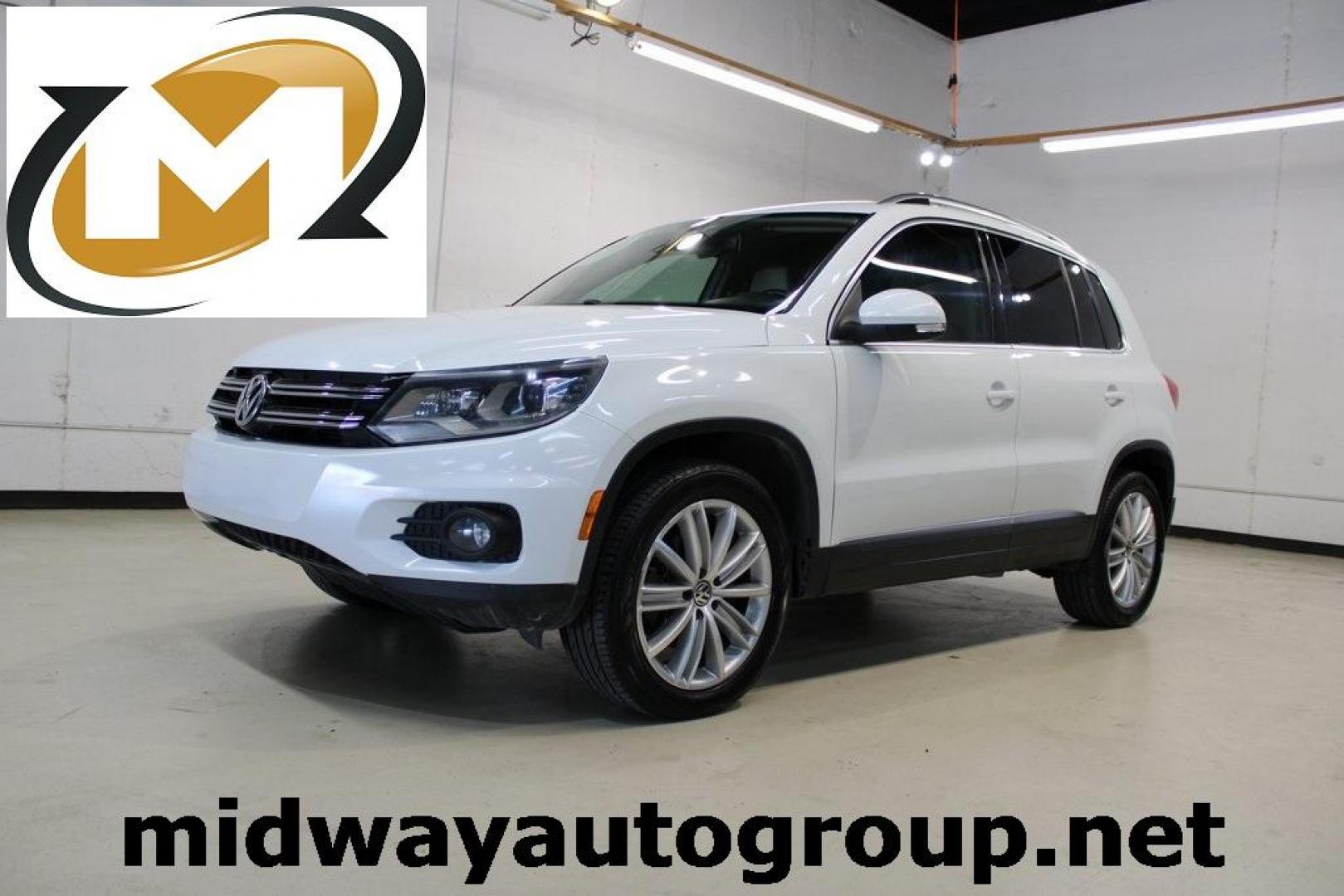 2016 Pure White Volkswagen Tiguan SE (WVGAV7AX9GW) with an 2.0L 4-Cylinder Turbocharged engine, Automatic transmission, located at 15300 Midway Rd., Addison, TX, 75001, (972) 702-0011, 32.958321, -96.838074 - Photo#0