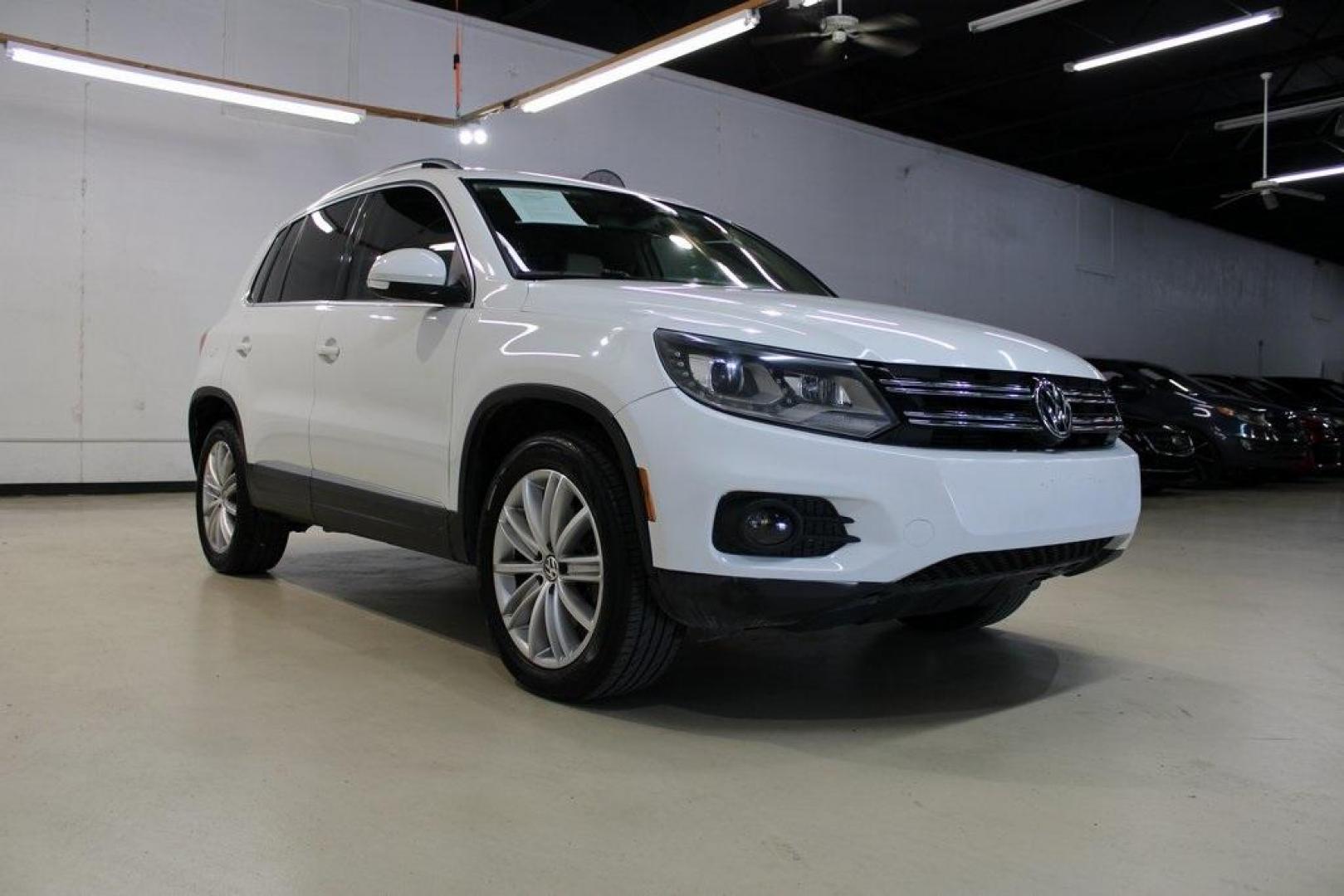 2016 Pure White Volkswagen Tiguan SE (WVGAV7AX9GW) with an 2.0L 4-Cylinder Turbocharged engine, Automatic transmission, located at 15300 Midway Rd., Addison, TX, 75001, (972) 702-0011, 32.958321, -96.838074 - Photo#1