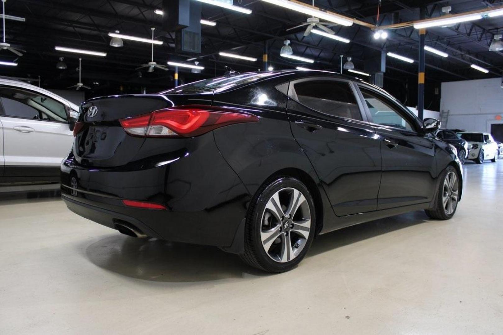 2016 Black Noir Pearl /Gray Hyundai Elantra Sport (KMHDH4AH4GU) with an 2.0L 4-Cylinder DOHC 16V engine, Manual transmission, located at 15300 Midway Rd., Addison, TX, 75001, (972) 702-0011, 32.958321, -96.838074 - HOME OF THE NO HAGGLE PRICE - WHOLESALE PRICES TO THE PUBLIC!! Elantra Sport, 4D Sedan, 2.0L 4-Cylinder DOHC 16V, 6-Speed Manual, FWD, Black Noir Pearl, Gray Cloth.<br><br>Black Noir Pearl 2016 Hyundai Elantra Sport<br><br>Recent Arrival! 24/34 City/Highway MPG<br><br>Awards:<br> * 2016 KBB.com Bes - Photo#2