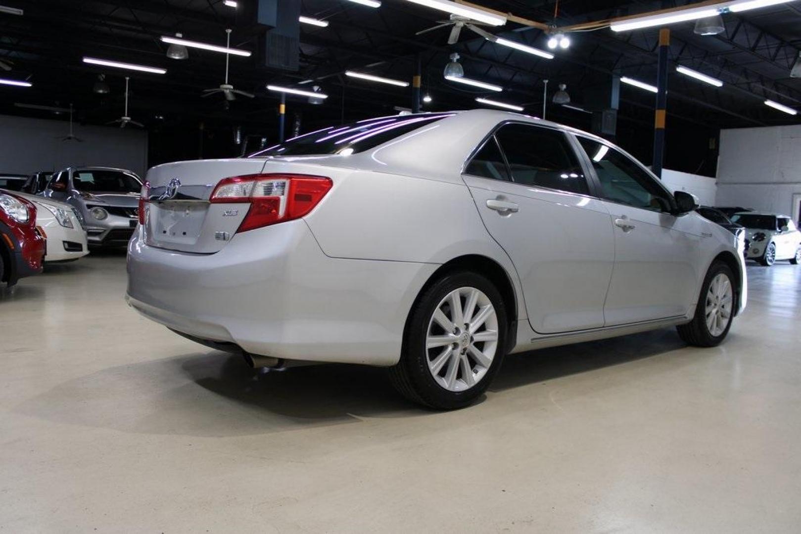 2012 Classic Silver Metallic /Ivory Toyota Camry Hybrid XLE (4T1BD1FK6CU) with an 2.5L I4 Hybrid DOHC engine, CVT transmission, located at 15300 Midway Rd., Addison, TX, 75001, (972) 702-0011, 32.958321, -96.838074 - HOME OF THE NO HAGGLE PRICE - WHOLESALE PRICES TO THE PUBLIC!! Camry Hybrid XLE, 4D Sedan, 2.5L I4 Hybrid DOHC, eCVT, FWD, Silver, Cloth.<br><br>Silver 2012 Toyota Camry Hybrid XLE<br><br>Recent Arrival! 40/38 City/Highway MPG<br><br>Awards:<br> * 2012 KBB.com Best Resale Value Awards<br><br>At Mid - Photo#2