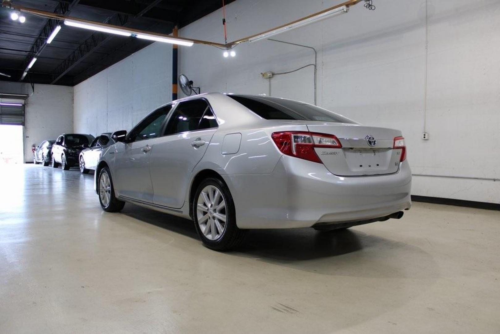 2012 Classic Silver Metallic /Ivory Toyota Camry Hybrid XLE (4T1BD1FK6CU) with an 2.5L I4 Hybrid DOHC engine, CVT transmission, located at 15300 Midway Rd., Addison, TX, 75001, (972) 702-0011, 32.958321, -96.838074 - HOME OF THE NO HAGGLE PRICE - WHOLESALE PRICES TO THE PUBLIC!! Camry Hybrid XLE, 4D Sedan, 2.5L I4 Hybrid DOHC, eCVT, FWD, Silver, Cloth.<br><br>Silver 2012 Toyota Camry Hybrid XLE<br><br>Recent Arrival! 40/38 City/Highway MPG<br><br>Awards:<br> * 2012 KBB.com Best Resale Value Awards<br><br>At Mid - Photo#3