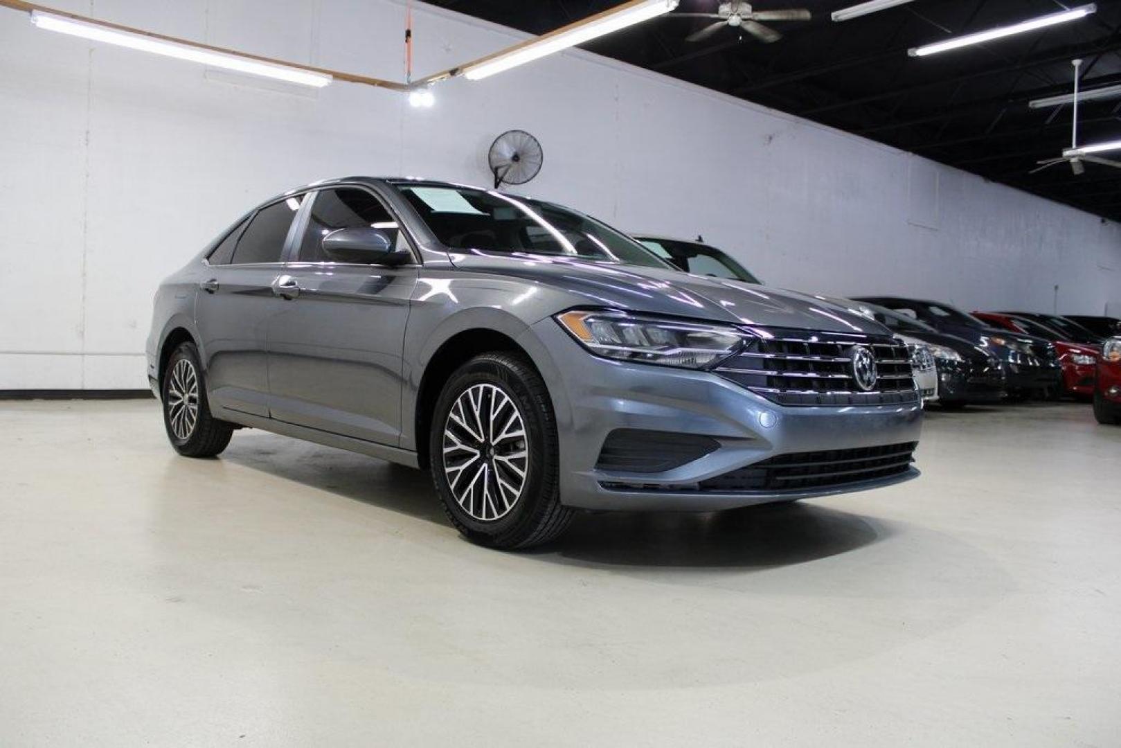 2021 Pyrite Silver Metallic /Storm Gray Volkswagen Jetta 1.4T S (3VWC57BU6MM) with an 1.4L TSI engine, Automatic transmission, located at 15300 Midway Rd., Addison, TX, 75001, (972) 702-0011, 32.958321, -96.838074 - Photo#1