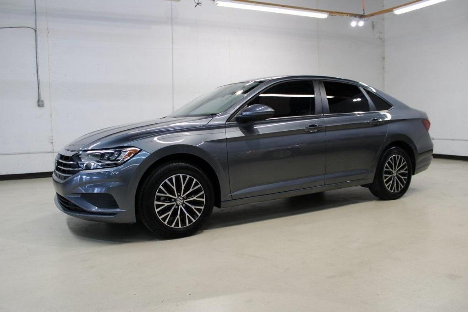 2021 Pyrite Silver Metallic /Storm Gray Volkswagen Jetta 1.4T S (3VWC57BU6MM) with an 1.4L TSI engine, Automatic transmission, located at 15300 Midway Rd., Addison, TX, 75001, (972) 702-0011, 32.958321, -96.838074 - Photo#4