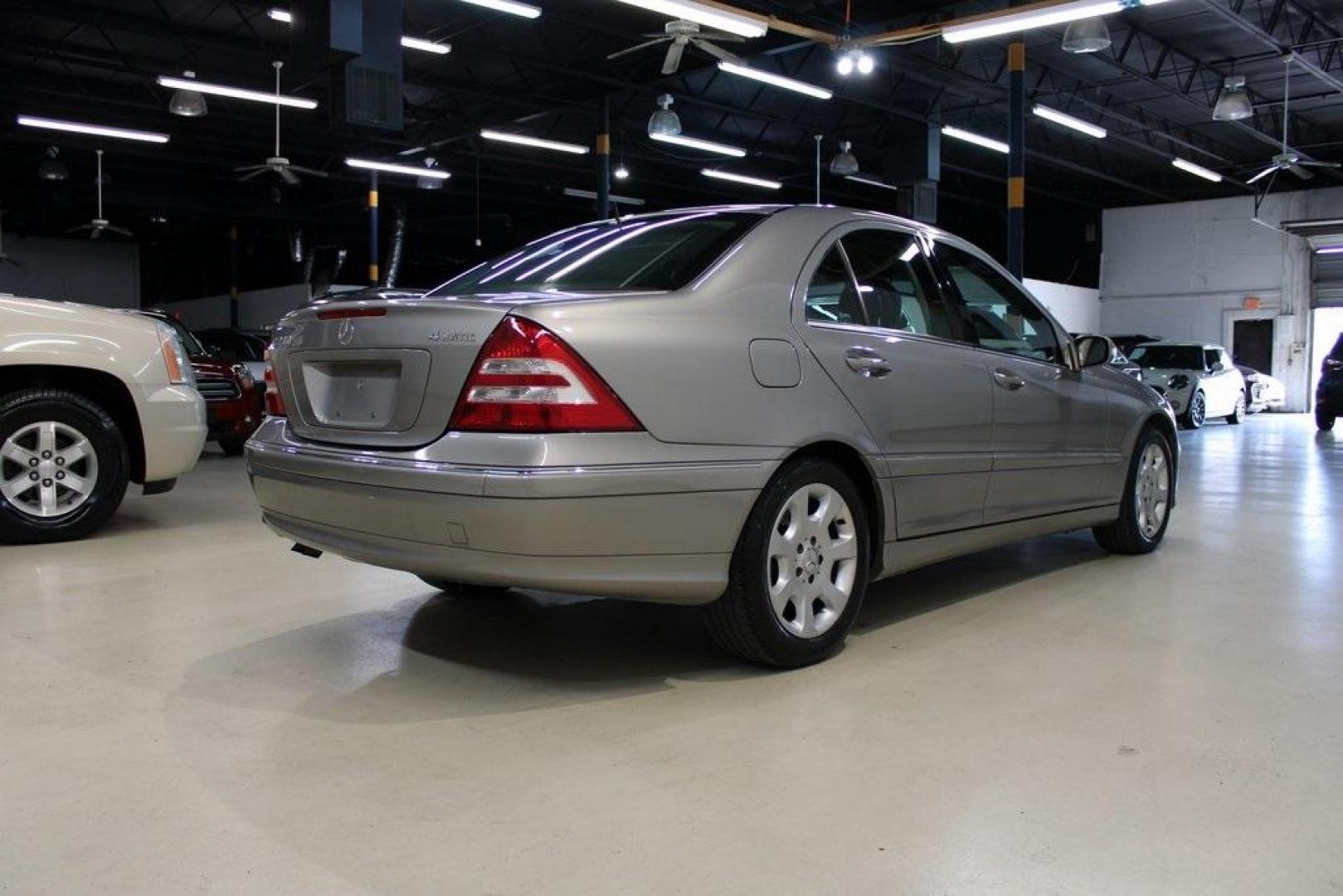 2005 Gold /Black Mercedes-Benz C-Class C 240 (WDBRF81J65F) with an 2.6L V6 SFI engine, Automatic transmission, located at 15300 Midway Rd., Addison, TX, 75001, (972) 702-0011, 32.958321, -96.838074 - HOME OF THE NO HAGGLE PRICE - WHOLESALE PRICES TO THE PUBLIC!! C 240 Luxury 4MATIC, 4D Sedan, 2.6L V6 SFI, 5-Speed Automatic with Touch Shift, 4MATIC, Gold, Black Leather.<br><br>Gold 2005 Mercedes-Benz C-Class C 240<br><br><br>At Midway Auto Group, we strive to provide you with the best quality veh - Photo#2