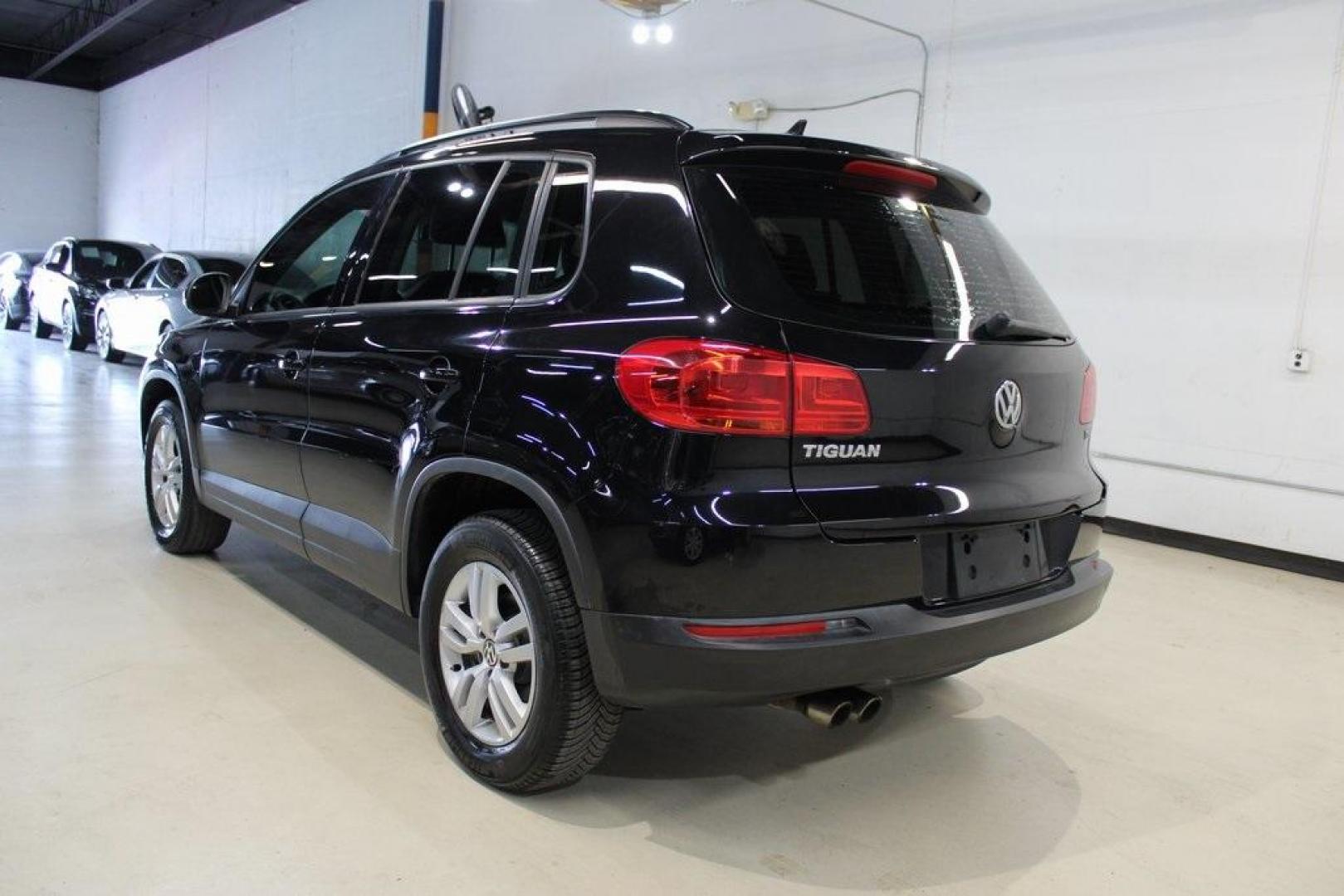 2017 Deep Black Pearl /Charcoal Black Volkswagen Tiguan 2.0T S (WVGAV7AX3HK) with an 2.0L TSI DOHC engine, Automatic transmission, located at 15300 Midway Rd., Addison, TX, 75001, (972) 702-0011, 32.958321, -96.838074 - HOME OF THE NO HAGGLE PRICE - WHOLESALE PRICES TO THE PUBLIC!! Tiguan 2.0T S, 4D Sport Utility, 2.0L TSI DOHC, 6-Speed Automatic with Tiptronic, FWD, Black, Charcoal Black w/V-Tex Leatherette Seating Surfaces.<br><br>Black 2017 Volkswagen Tiguan 2.0T S<br><br><br>At Midway Auto Group, we strive to p - Photo#3