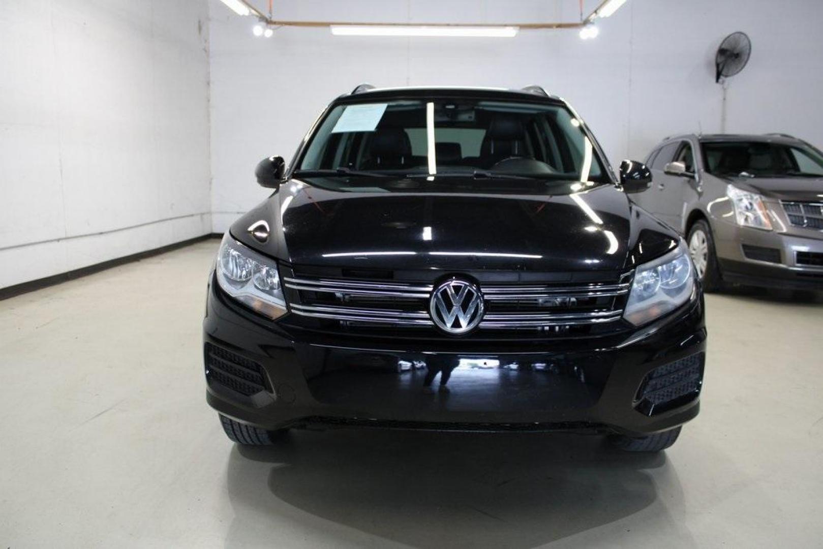 2017 Deep Black Pearl /Charcoal Black Volkswagen Tiguan 2.0T S (WVGAV7AX3HK) with an 2.0L TSI DOHC engine, Automatic transmission, located at 15300 Midway Rd., Addison, TX, 75001, (972) 702-0011, 32.958321, -96.838074 - HOME OF THE NO HAGGLE PRICE - WHOLESALE PRICES TO THE PUBLIC!! Tiguan 2.0T S, 4D Sport Utility, 2.0L TSI DOHC, 6-Speed Automatic with Tiptronic, FWD, Black, Charcoal Black w/V-Tex Leatherette Seating Surfaces.<br><br>Black 2017 Volkswagen Tiguan 2.0T S<br><br><br>At Midway Auto Group, we strive to p - Photo#5