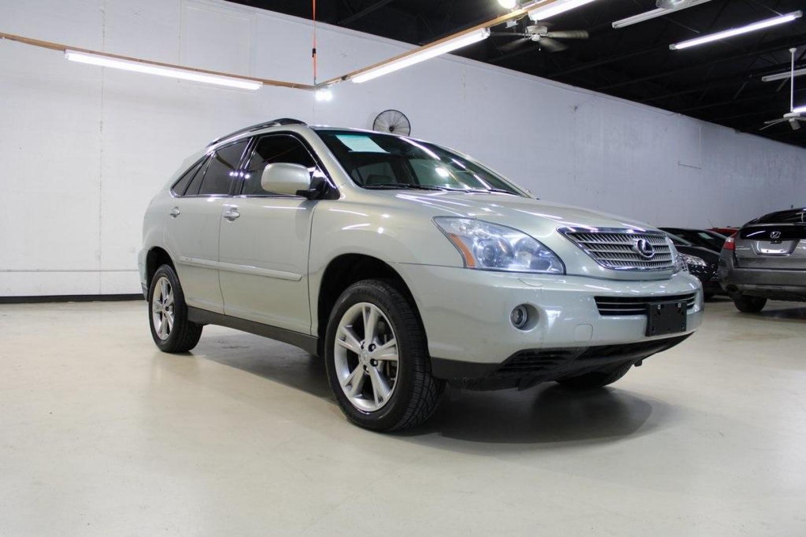 2008 Gold /Ivory Lexus RX 400h (JTJHW31U882) with an 3.3L V6 VVT-i engine, CVT transmission, located at 15300 Midway Rd., Addison, TX, 75001, (972) 702-0011, 32.958321, -96.838074 - HOME OF THE NO HAGGLE PRICE - WHOLESALE PRICES TO THE PUBLIC!! RX 400h, 4D Sport Utility, 3.3L V6 VVT-i, eCVT, AWD, Gold, Ivory w/Fabric Seat Trim.<br><br>Gold 2008 Lexus RX 400h<br><br><br>Awards:<br> * 2008 KBB.com Brand Image Awards<br><br>At Midway Auto Group, we strive to provide you with the - Photo#1