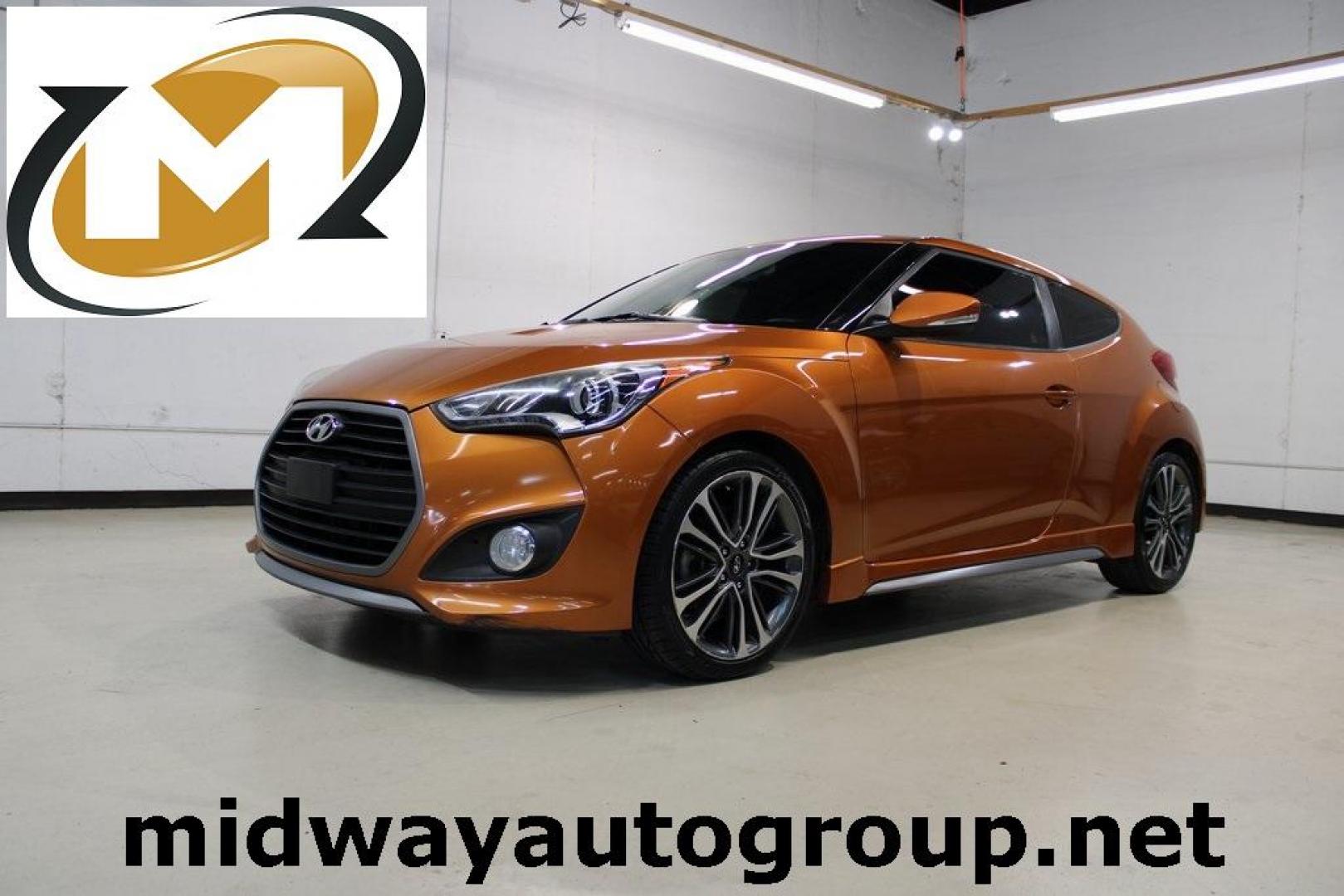 2016 Vitamin C Pearl /Black Hyundai Veloster Turbo (KMHTC6AE8GU) with an I4 engine, Automatic transmission, located at 15300 Midway Rd., Addison, TX, 75001, (972) 702-0011, 32.958321, -96.838074 - HOME OF THE NO HAGGLE PRICE - WHOLESALE PRICES TO THE PUBLIC!! Veloster Turbo, 3D Hatchback, I4, 7-Speed EcoShift Dual Clutch, FWD, Vitamin C Pearl, Black Leather.<br><br>Vitamin C Pearl 2016 Hyundai Veloster Turbo<br><br>27/33 City/Highway MPG<br><br>Awards:<br> * 2016 KBB.com 10 Coolest New Cars - Photo#0