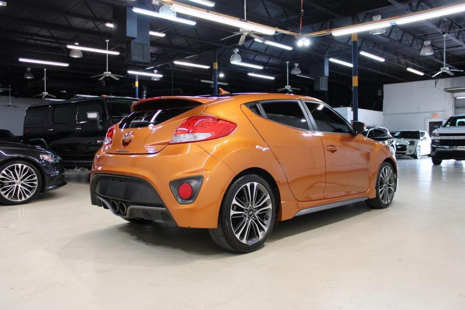 2016 Vitamin C Pearl /Black Hyundai Veloster Turbo (KMHTC6AE8GU) with an I4 engine, Automatic transmission, located at 15300 Midway Rd., Addison, TX, 75001, (972) 702-0011, 32.958321, -96.838074 - HOME OF THE NO HAGGLE PRICE - WHOLESALE PRICES TO THE PUBLIC!! Veloster Turbo, 3D Hatchback, I4, 7-Speed EcoShift Dual Clutch, FWD, Vitamin C Pearl, Black Leather.<br><br>Vitamin C Pearl 2016 Hyundai Veloster Turbo<br><br>27/33 City/Highway MPG<br><br>Awards:<br> * 2016 KBB.com 10 Coolest New Cars - Photo#2