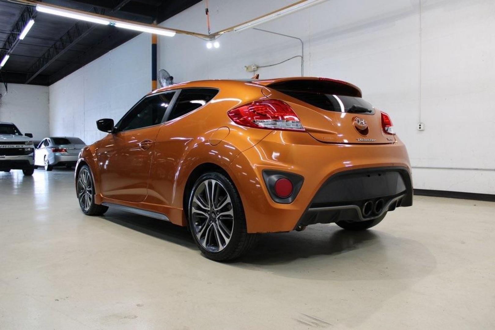 2016 Vitamin C Pearl /Black Hyundai Veloster Turbo (KMHTC6AE8GU) with an I4 engine, Automatic transmission, located at 15300 Midway Rd., Addison, TX, 75001, (972) 702-0011, 32.958321, -96.838074 - HOME OF THE NO HAGGLE PRICE - WHOLESALE PRICES TO THE PUBLIC!! Veloster Turbo, 3D Hatchback, I4, 7-Speed EcoShift Dual Clutch, FWD, Vitamin C Pearl, Black Leather.<br><br>Vitamin C Pearl 2016 Hyundai Veloster Turbo<br><br>27/33 City/Highway MPG<br><br>Awards:<br> * 2016 KBB.com 10 Coolest New Cars - Photo#3