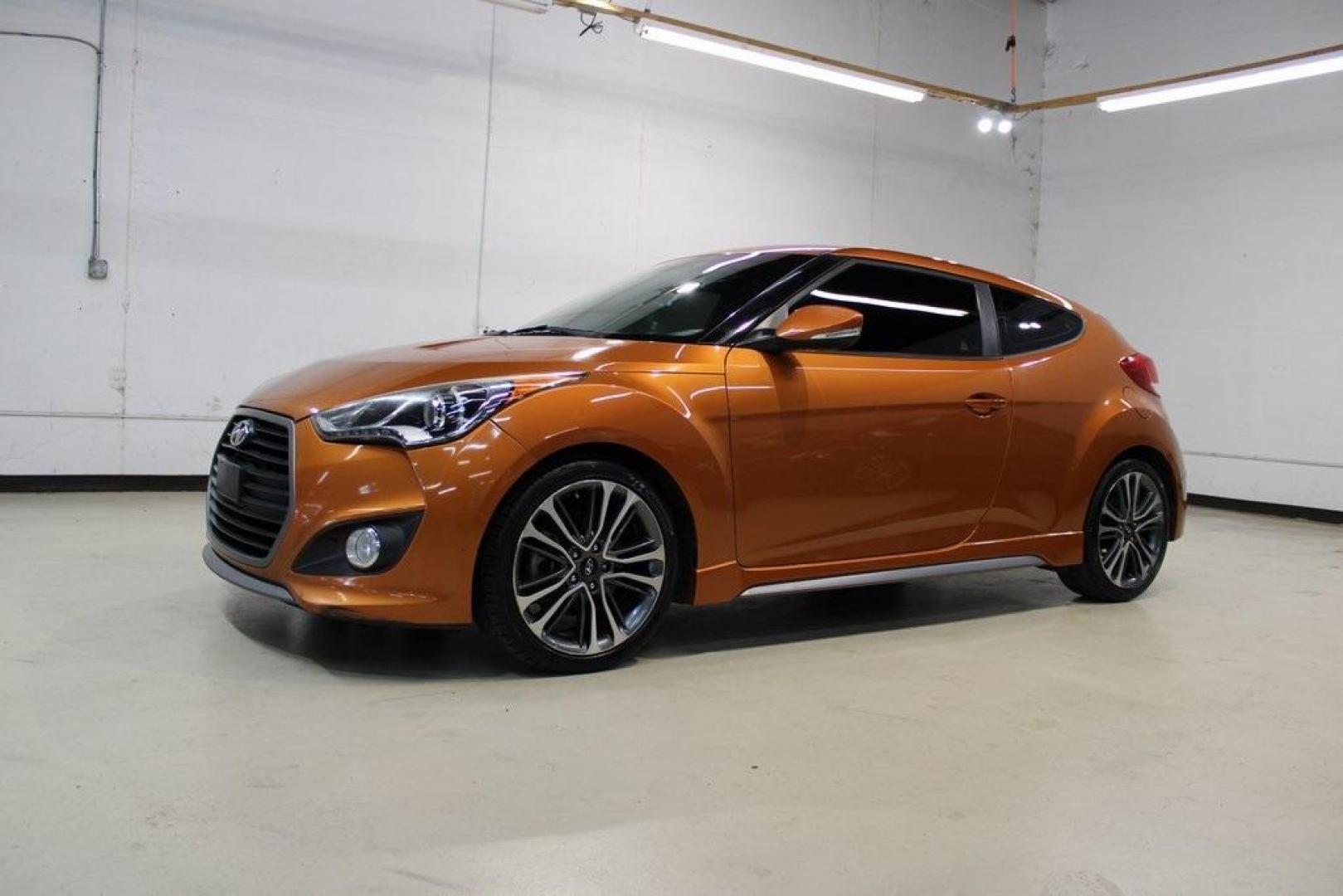 2016 Vitamin C Pearl /Black Hyundai Veloster Turbo (KMHTC6AE8GU) with an I4 engine, Automatic transmission, located at 15300 Midway Rd., Addison, TX, 75001, (972) 702-0011, 32.958321, -96.838074 - HOME OF THE NO HAGGLE PRICE - WHOLESALE PRICES TO THE PUBLIC!! Veloster Turbo, 3D Hatchback, I4, 7-Speed EcoShift Dual Clutch, FWD, Vitamin C Pearl, Black Leather.<br><br>Vitamin C Pearl 2016 Hyundai Veloster Turbo<br><br>27/33 City/Highway MPG<br><br>Awards:<br> * 2016 KBB.com 10 Coolest New Cars - Photo#4