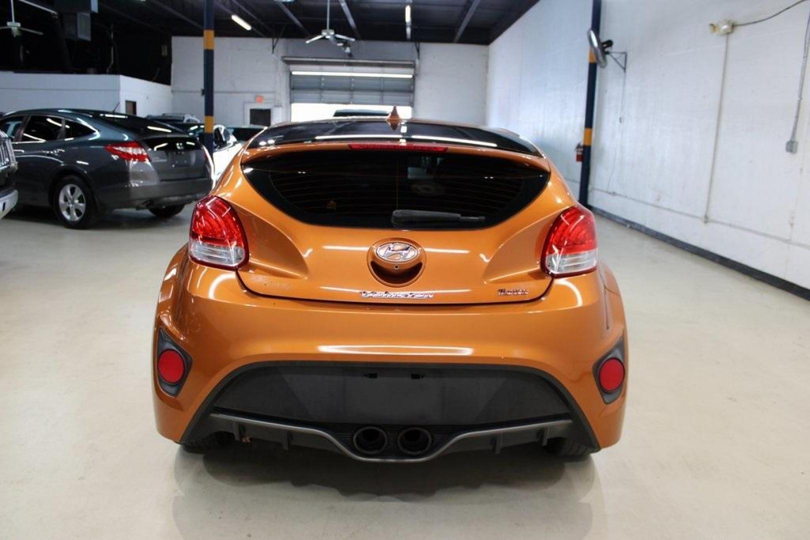 2016 Vitamin C Pearl /Black Hyundai Veloster Turbo (KMHTC6AE8GU) with an I4 engine, Automatic transmission, located at 15300 Midway Rd., Addison, TX, 75001, (972) 702-0011, 32.958321, -96.838074 - HOME OF THE NO HAGGLE PRICE - WHOLESALE PRICES TO THE PUBLIC!! Veloster Turbo, 3D Hatchback, I4, 7-Speed EcoShift Dual Clutch, FWD, Vitamin C Pearl, Black Leather.<br><br>Vitamin C Pearl 2016 Hyundai Veloster Turbo<br><br>27/33 City/Highway MPG<br><br>Awards:<br> * 2016 KBB.com 10 Coolest New Cars - Photo#7