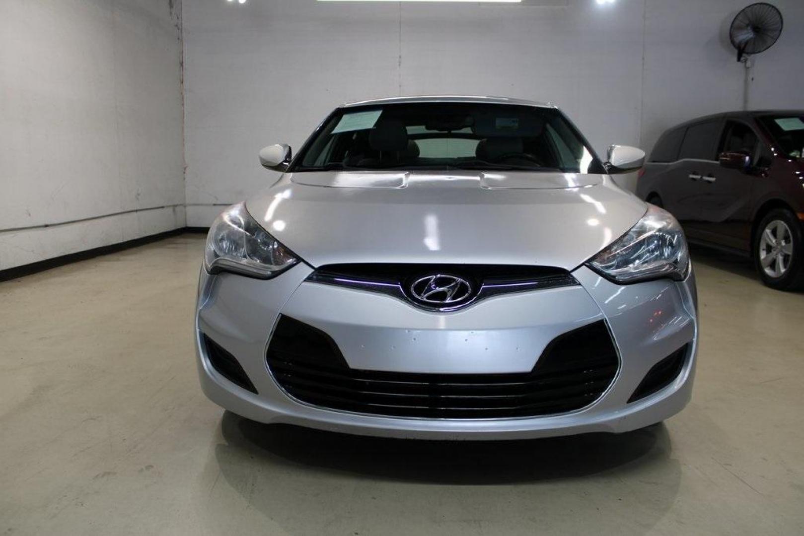 2012 Ironman Silver /Gray Hyundai Veloster Base (KMHTC6AD0CU) with an 1.6L 4-Cylinder DGI DOHC engine, Automatic transmission, located at 15300 Midway Rd., Addison, TX, 75001, (972) 702-0011, 32.958321, -96.838074 - HOME OF THE NO HAGGLE PRICE - WHOLESALE PRICES TO THE PUBLIC!! 3D Hatchback, 1.6L 4-Cylinder DGI DOHC, 6-Speed Automatic, FWD, Ironman Silver, Gray Cloth.<br><br>Ironman Silver 2012 Hyundai Veloster<br><br>27/35 City/Highway MPG<br><br>Awards:<br> * 2012 KBB.com 10 Coolest New Cars Under $18,000<br - Photo#5