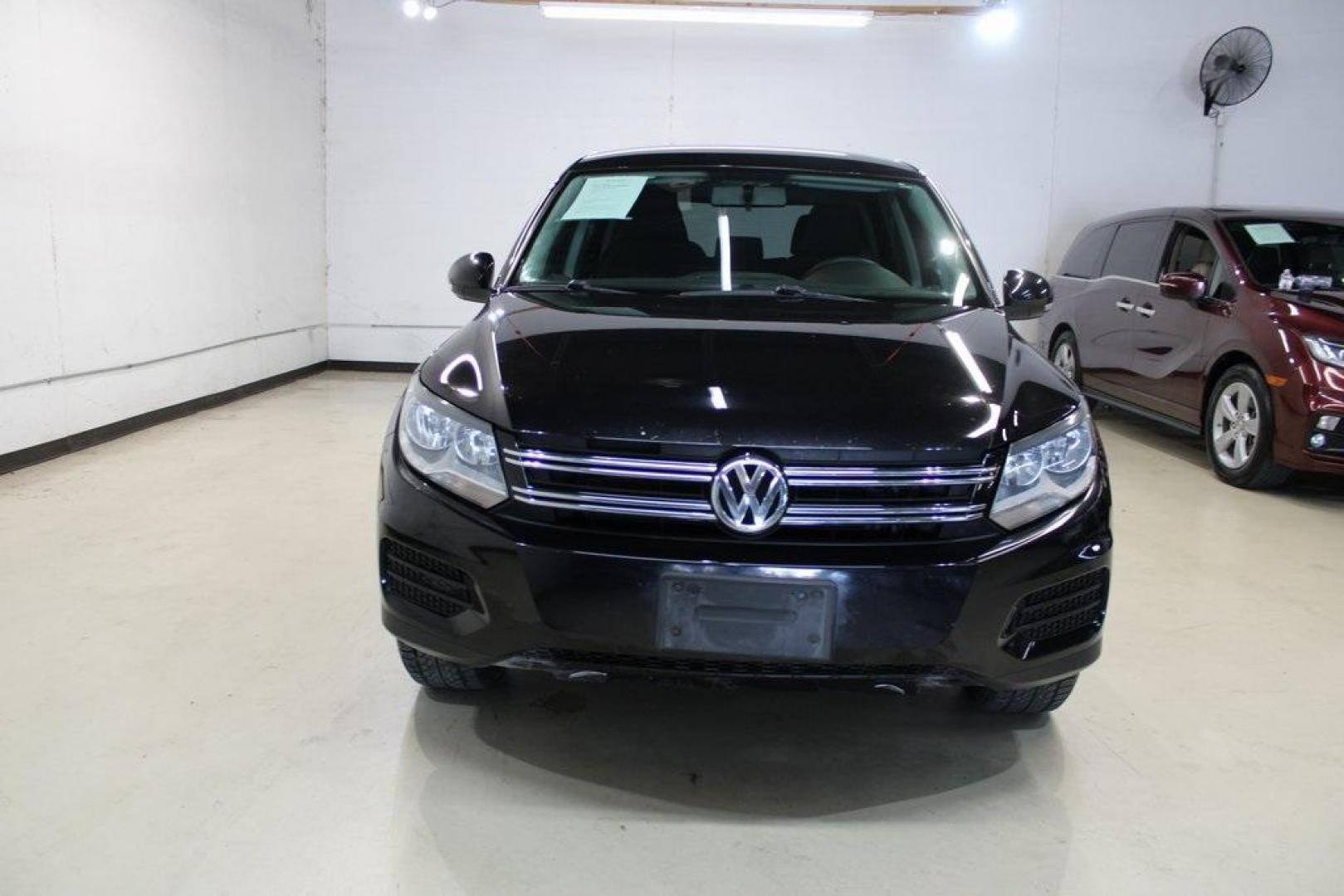 2017 Deep Black Pearl /Charcoal Black Volkswagen Tiguan 2.0T S (WVGAV7AXXHK) with an 2.0L TSI DOHC engine, Automatic transmission, located at 15300 Midway Rd., Addison, TX, 75001, (972) 702-0011, 32.958321, -96.838074 - HOME OF THE NO HAGGLE PRICE - WHOLESALE PRICES TO THE PUBLIC!! Tiguan 2.0T S, 4D Sport Utility, 2.0L TSI DOHC, 6-Speed Automatic with Tiptronic, FWD, Black.<br><br>Black 2017 Volkswagen Tiguan 2.0T S<br><br>Recent Arrival!<br><br><br>At Midway Auto Group, we strive to provide you with the best quali - Photo#5