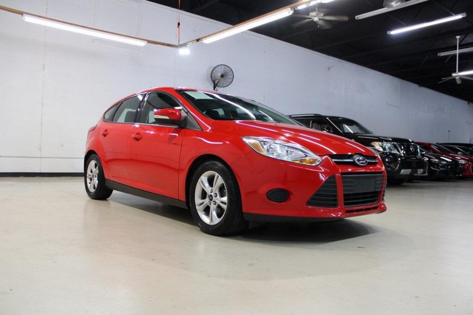 2014 Red Ford Focus SE (1FADP3K27EL) with an I4 engine, located at 15300 Midway Rd., Addison, TX, 75001, (972) 702-0011, 32.958321, -96.838074 - Photo#1