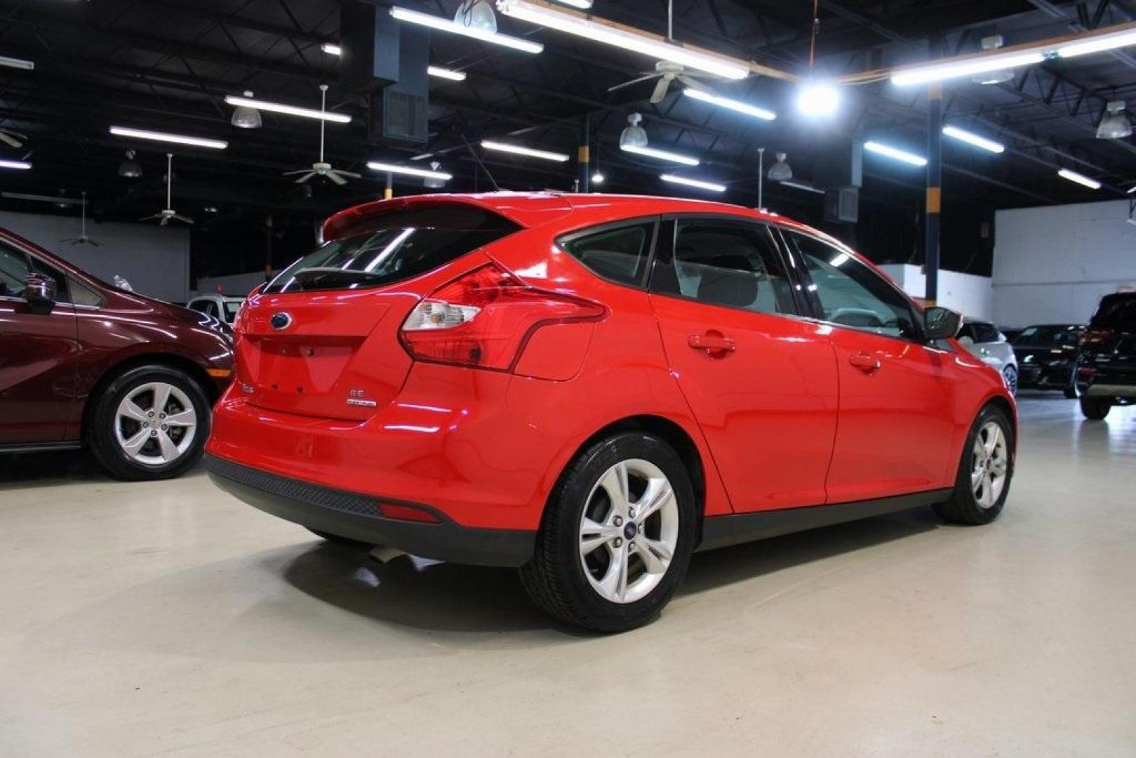 2014 Red Ford Focus SE (1FADP3K27EL) with an I4 engine, located at 15300 Midway Rd., Addison, TX, 75001, (972) 702-0011, 32.958321, -96.838074 - Photo#2