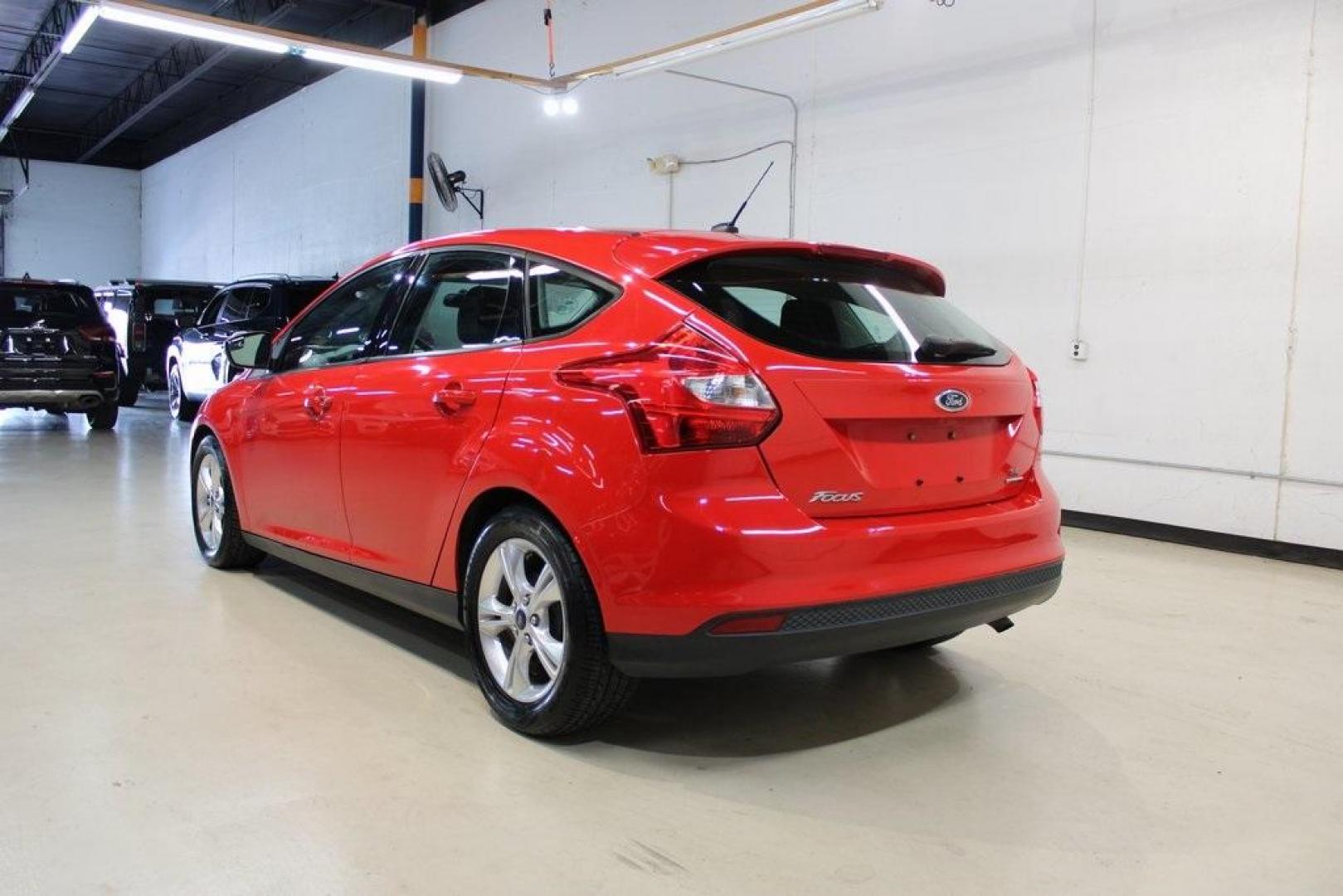 2014 Red Ford Focus SE (1FADP3K27EL) with an I4 engine, located at 15300 Midway Rd., Addison, TX, 75001, (972) 702-0011, 32.958321, -96.838074 - Photo#3