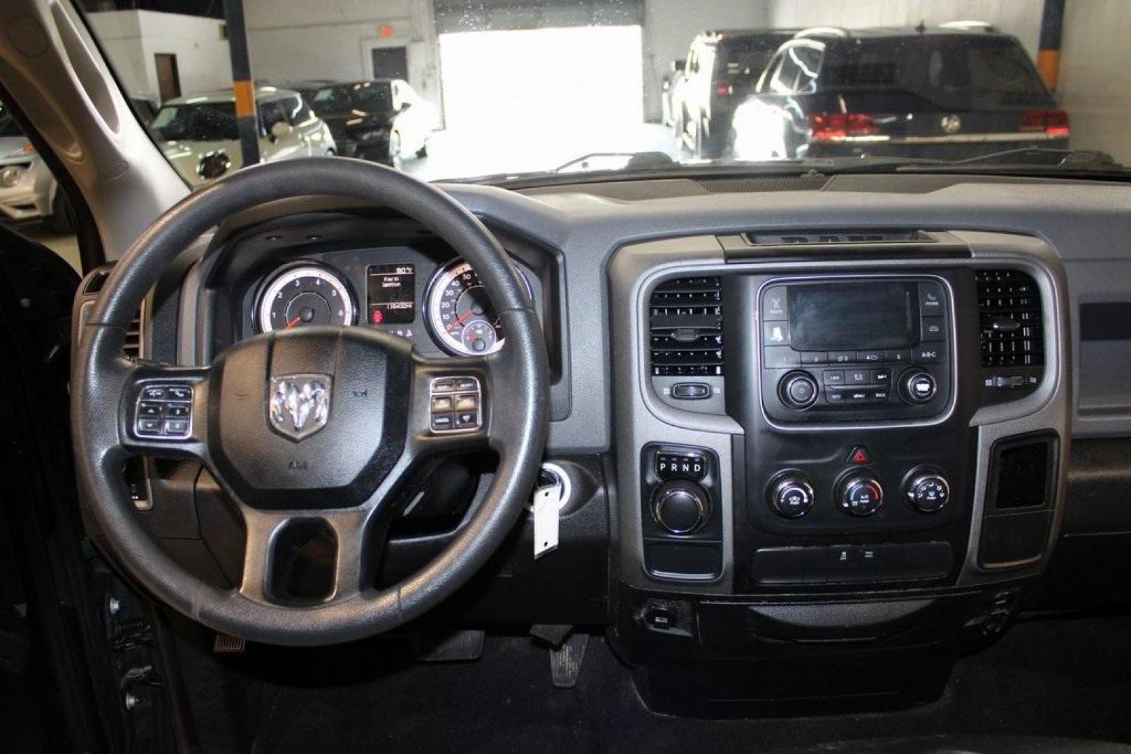 2018 Brilliant Black Crystal Pearlcoat /Black Ram 1500 Tradesman (1C6RR6FG3JS) with an 3.6L V6 24V VVT engine, Automatic transmission, located at 15300 Midway Rd., Addison, TX, 75001, (972) 702-0011, 32.958321, -96.838074 - HOME OF THE NO HAGGLE PRICE - WHOLESALE PRICES TO THE PUBLIC!! 1500 Tradesman, 4D Quad Cab, 3.6L V6 24V VVT, 8-Speed Automatic, RWD, Brilliant Black Crystal Pearlcoat, Black Cloth.<br><br>Brilliant Black Crystal Pearlcoat 2018 Ram 1500 Tradesman<br><br><br>At Midway Auto Group, we strive to provide - Photo#18