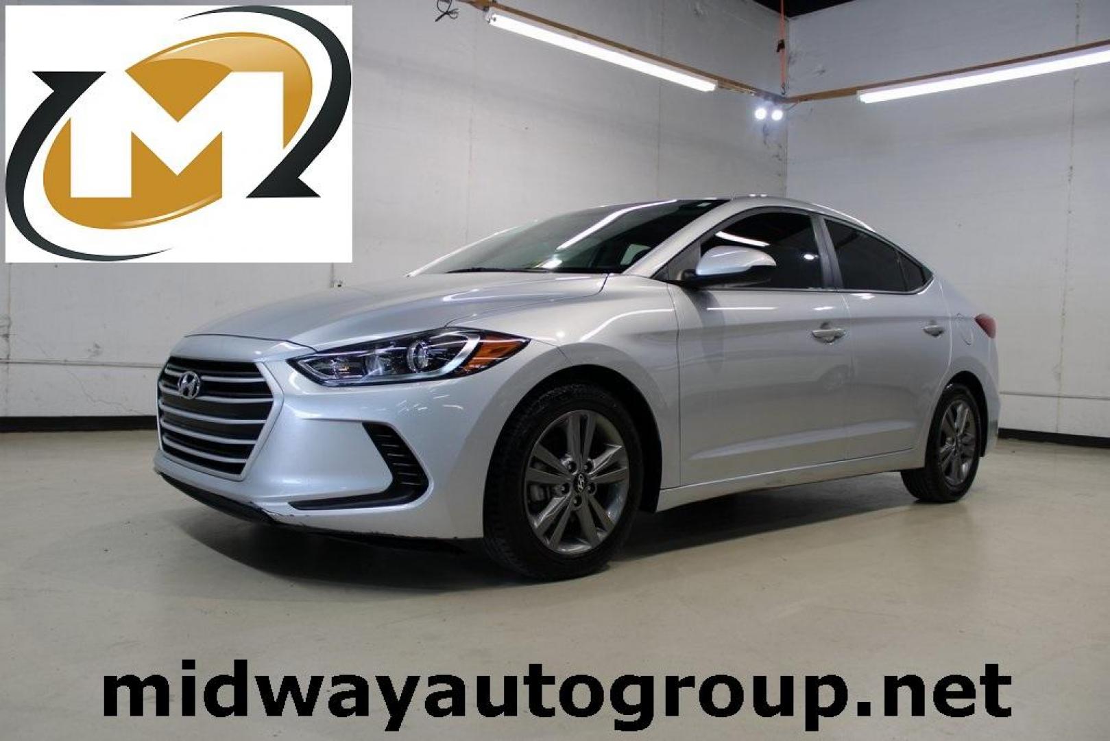 2018 Symphony Silver /Gray Hyundai Elantra SEL (5NPD84LF1JH) with an 2.0L 4-Cylinder DOHC 16V engine, Automatic transmission, located at 15300 Midway Rd., Addison, TX, 75001, (972) 702-0011, 32.958321, -96.838074 - HOME OF THE NO HAGGLE PRICE - WHOLESALE PRICES TO THE PUBLIC!! Elantra SEL, 4D Sedan, 2.0L 4-Cylinder DOHC 16V, 6-Speed Automatic with Shiftronic, FWD, Symphony Silver, Gray Cloth.<br><br>Symphony Silver 2018 Hyundai Elantra SEL<br><br>Recent Arrival! 28/37 City/Highway MPG<br><br>Awards:<br> * 201 - Photo#0