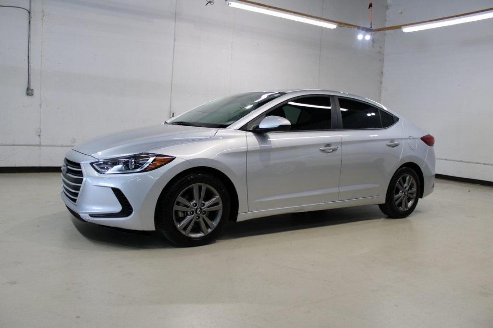 2018 Symphony Silver /Gray Hyundai Elantra SEL (5NPD84LF1JH) with an 2.0L 4-Cylinder DOHC 16V engine, Automatic transmission, located at 15300 Midway Rd., Addison, TX, 75001, (972) 702-0011, 32.958321, -96.838074 - HOME OF THE NO HAGGLE PRICE - WHOLESALE PRICES TO THE PUBLIC!! Elantra SEL, 4D Sedan, 2.0L 4-Cylinder DOHC 16V, 6-Speed Automatic with Shiftronic, FWD, Symphony Silver, Gray Cloth.<br><br>Symphony Silver 2018 Hyundai Elantra SEL<br><br>Recent Arrival! 28/37 City/Highway MPG<br><br>Awards:<br> * 201 - Photo#4