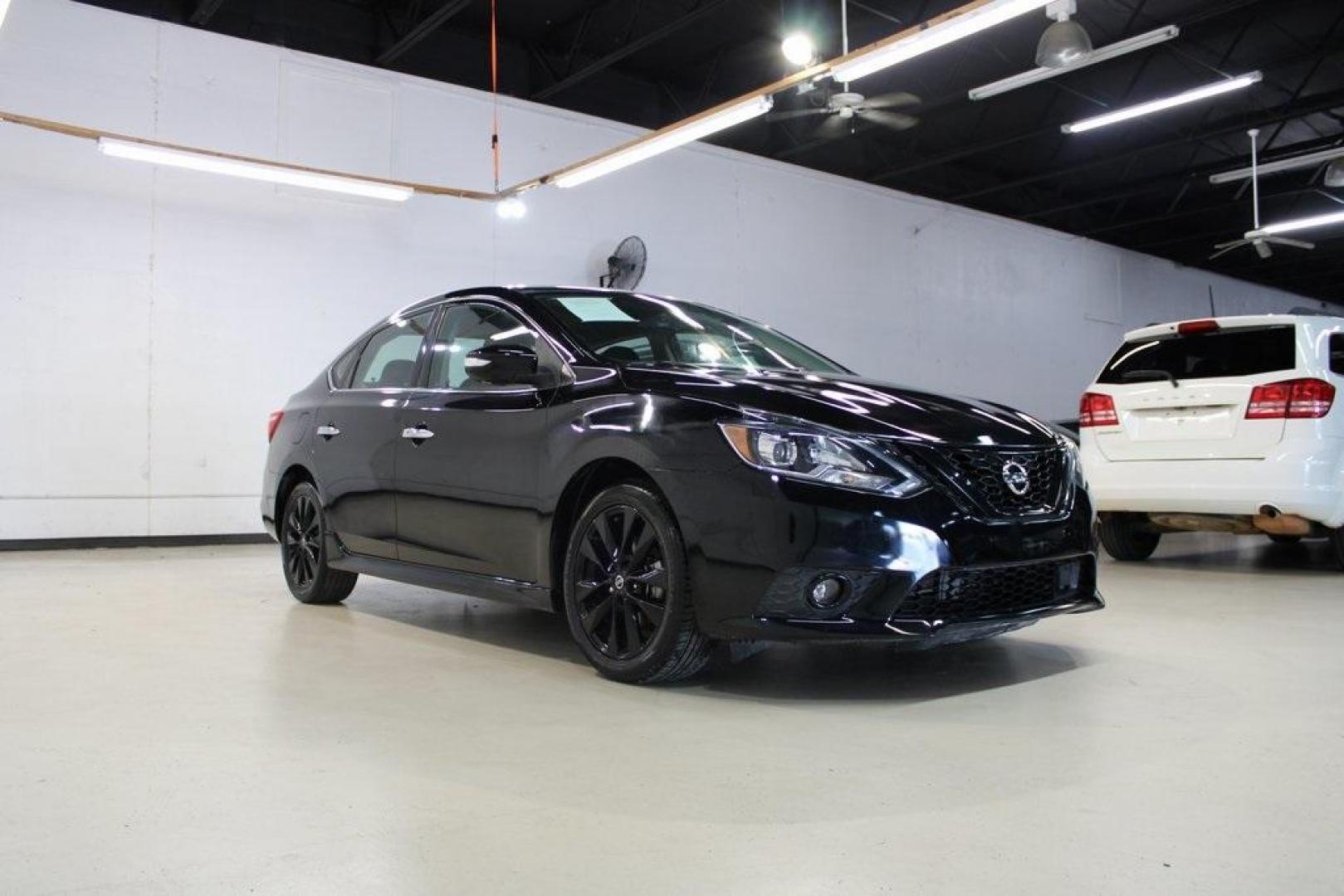 2018 Super Black /Charcoal Nissan Sentra SR (3N1AB7AP8JY) with an 1.8L 4-Cylinder DOHC 16V engine, CVT transmission, located at 15300 Midway Rd., Addison, TX, 75001, (972) 702-0011, 32.958321, -96.838074 - HOME OF THE NO HAGGLE PRICE - WHOLESALE PRICES TO THE PUBLIC!! Sentra SR, 4D Sedan, 1.8L 4-Cylinder DOHC 16V, CVT with Xtronic, FWD, Super Black, Charcoal Cloth.<br><br>Super Black 2018 Nissan Sentra SR<br><br>29/37 City/Highway MPG<br><br><br>At Midway Auto Group, we strive to provide you with the - Photo#1