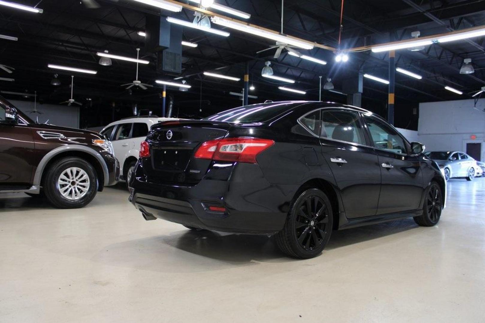 2018 Super Black /Charcoal Nissan Sentra SR (3N1AB7AP8JY) with an 1.8L 4-Cylinder DOHC 16V engine, CVT transmission, located at 15300 Midway Rd., Addison, TX, 75001, (972) 702-0011, 32.958321, -96.838074 - HOME OF THE NO HAGGLE PRICE - WHOLESALE PRICES TO THE PUBLIC!! Sentra SR, 4D Sedan, 1.8L 4-Cylinder DOHC 16V, CVT with Xtronic, FWD, Super Black, Charcoal Cloth.<br><br>Super Black 2018 Nissan Sentra SR<br><br>29/37 City/Highway MPG<br><br><br>At Midway Auto Group, we strive to provide you with the - Photo#2