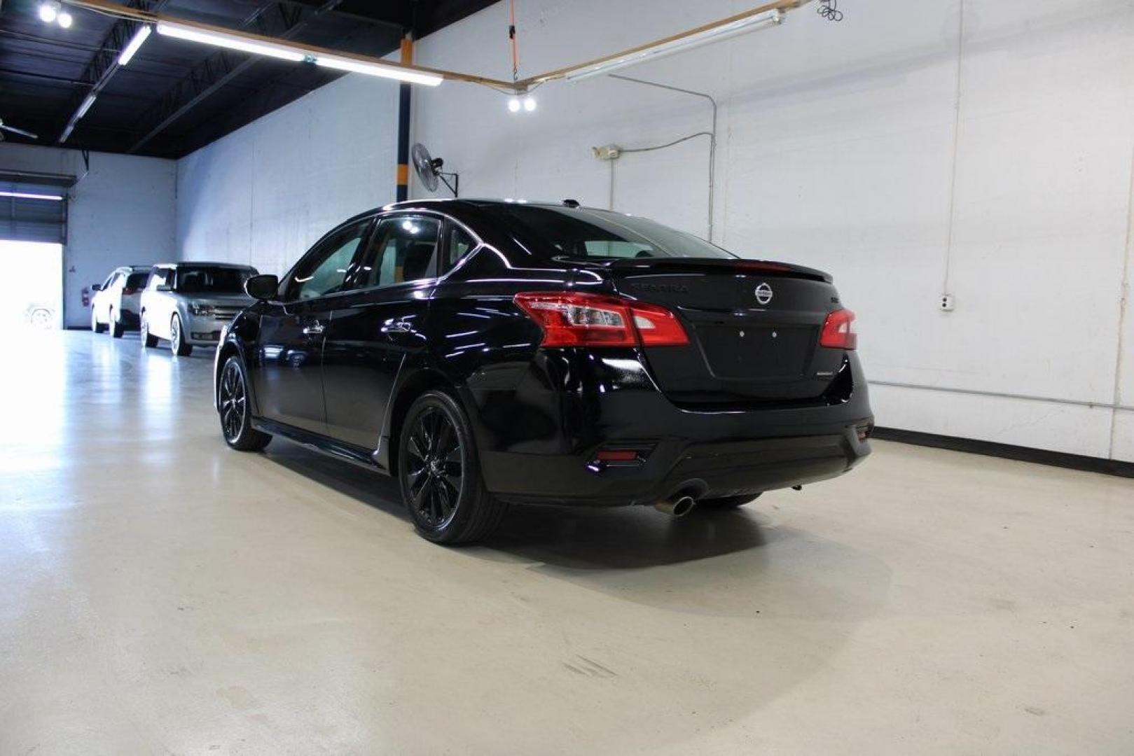 2018 Super Black /Charcoal Nissan Sentra SR (3N1AB7AP8JY) with an 1.8L 4-Cylinder DOHC 16V engine, CVT transmission, located at 15300 Midway Rd., Addison, TX, 75001, (972) 702-0011, 32.958321, -96.838074 - HOME OF THE NO HAGGLE PRICE - WHOLESALE PRICES TO THE PUBLIC!! Sentra SR, 4D Sedan, 1.8L 4-Cylinder DOHC 16V, CVT with Xtronic, FWD, Super Black, Charcoal Cloth.<br><br>Super Black 2018 Nissan Sentra SR<br><br>29/37 City/Highway MPG<br><br><br>At Midway Auto Group, we strive to provide you with the - Photo#3