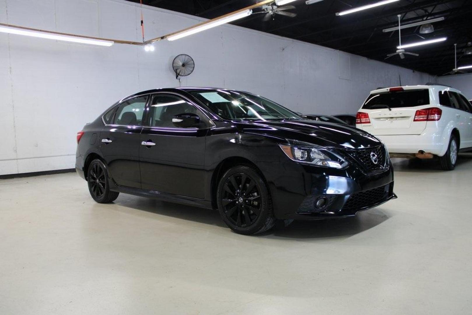 2018 Super Black /Charcoal Nissan Sentra SR (3N1AB7AP8JY) with an 1.8L 4-Cylinder DOHC 16V engine, CVT transmission, located at 15300 Midway Rd., Addison, TX, 75001, (972) 702-0011, 32.958321, -96.838074 - HOME OF THE NO HAGGLE PRICE - WHOLESALE PRICES TO THE PUBLIC!! Sentra SR, 4D Sedan, 1.8L 4-Cylinder DOHC 16V, CVT with Xtronic, FWD, Super Black, Charcoal Cloth.<br><br>Super Black 2018 Nissan Sentra SR<br><br>29/37 City/Highway MPG<br><br><br>At Midway Auto Group, we strive to provide you with the - Photo#6