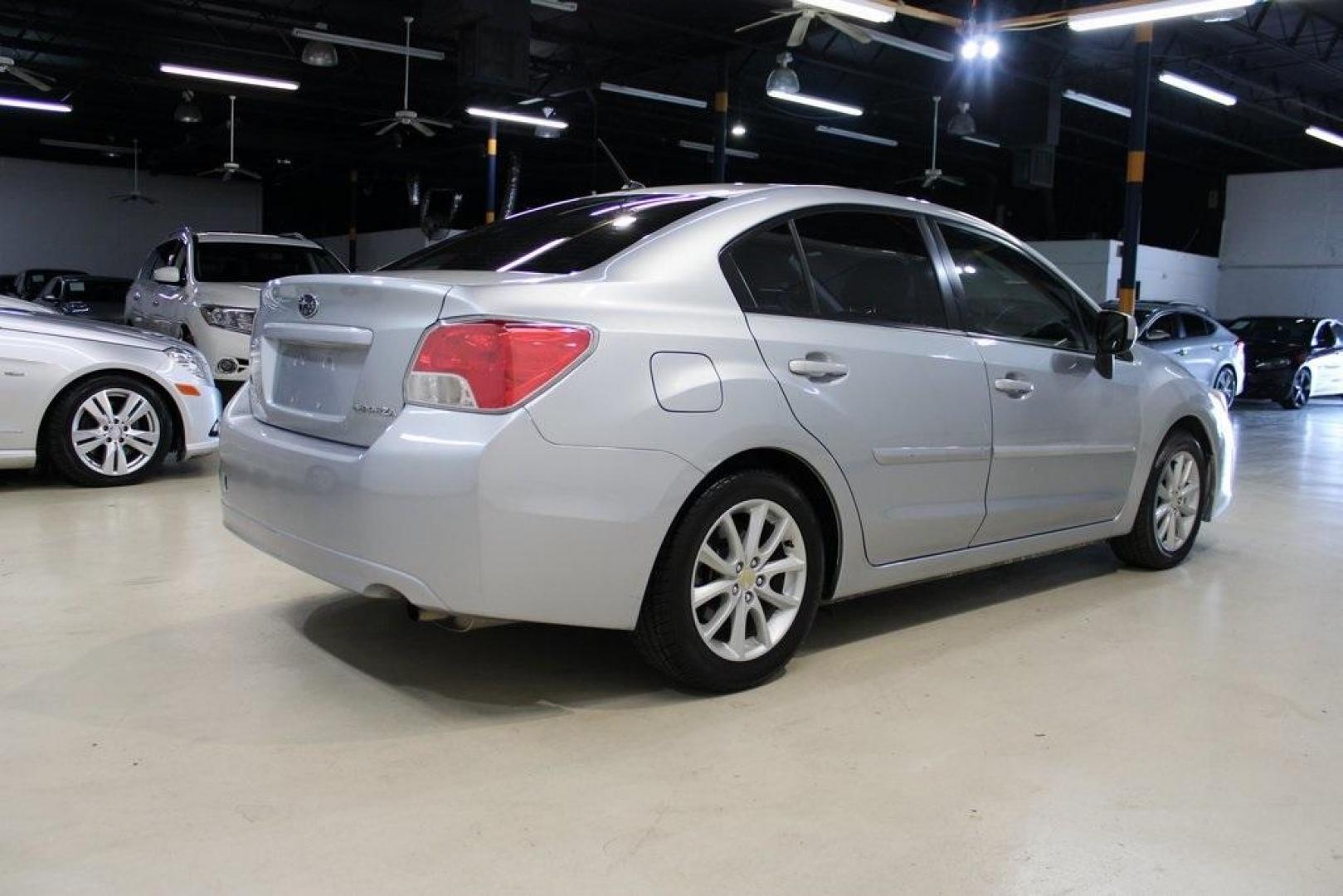 2013 Ice Silver Metallic /Black Subaru Impreza 2.0i Premium (JF1GJAB61DH) with an 2.0L 4-Cylinder SMPI DOHC 16V engine, CVT transmission, located at 15300 Midway Rd., Addison, TX, 75001, (972) 702-0011, 32.958321, -96.838074 - Photo#2