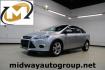 2014 Ingot Silver Metallic /Charcoal/Tangerine Scream Ford Focus SE (1FADP3F28EL) with an I4 engine, Automatic transmission, located at 15300 Midway Rd., Addison, TX, 75001, (972) 702-0011, 32.958321, -96.838074 - HOME OF THE NO HAGGLE PRICE - WHOLESALE PRICES TO THE PUBLIC!! Focus SE, 4D Sedan, I4, FWD, Silver, Charcoal/Tangerine Scream Cloth. Odometer is 60508 miles below market average!<br><br>Silver 2014 Ford Focus SE<br><br>26/36 City/Highway MPG<br><br>Awards:<br> * 2014 IIHS Top Safety Pick * 2014 K - Photo#0