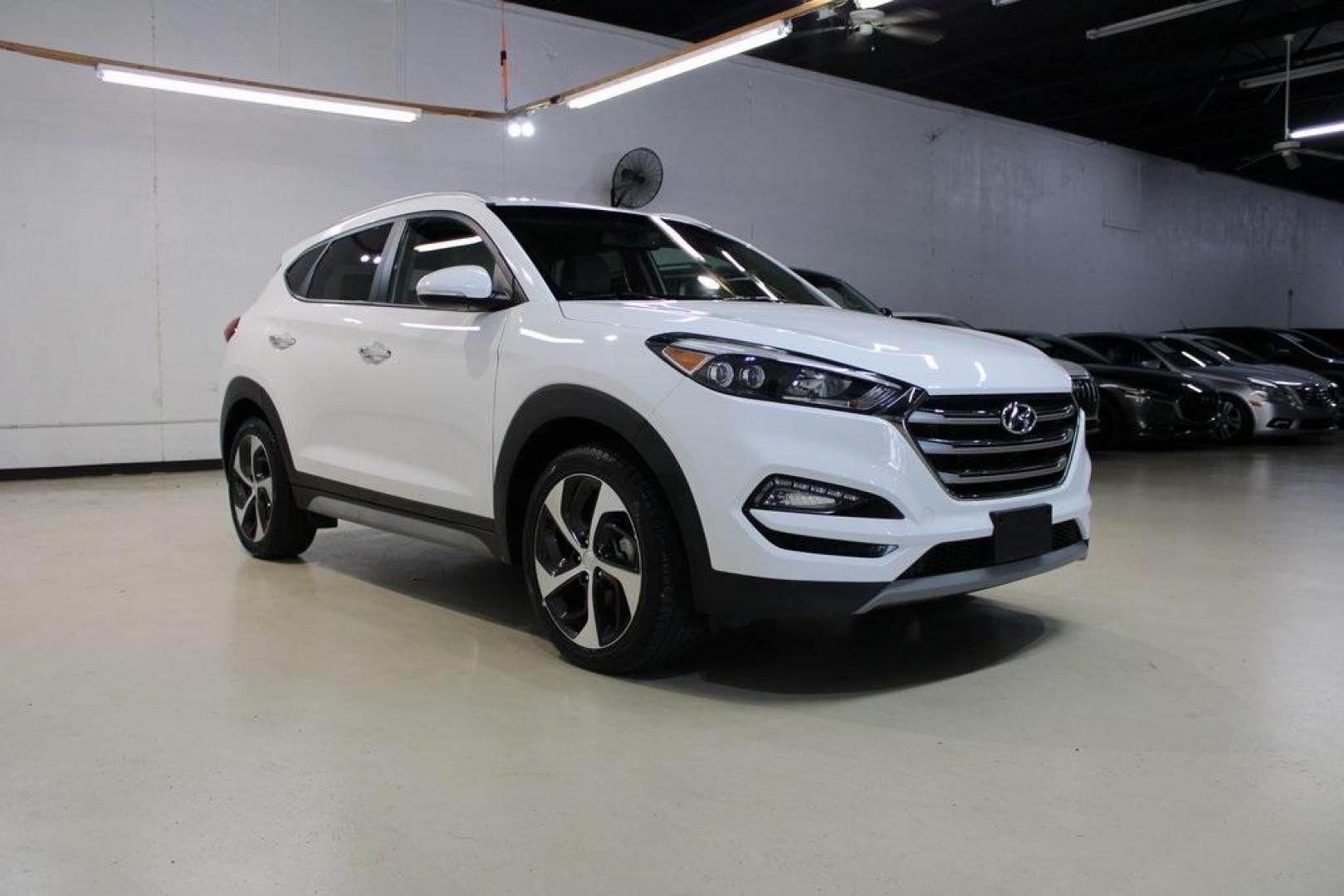 2018 Dazzling White /Beige Hyundai Tucson Limited (KM8J33A28JU) with an 1.6L I4 DGI Turbocharged DOHC 16V ULEV II 175hp engine, Automatic transmission, located at 15300 Midway Rd., Addison, TX, 75001, (972) 702-0011, 32.958321, -96.838074 - Photo#1