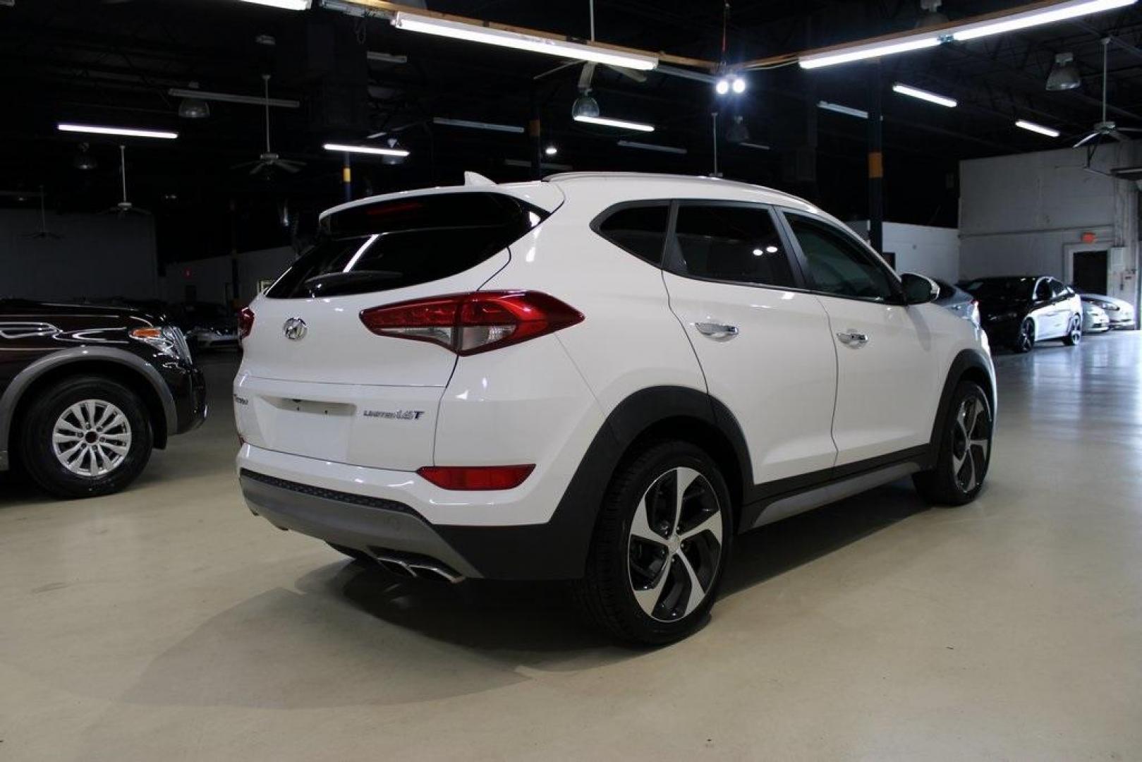 2018 Dazzling White /Beige Hyundai Tucson Limited (KM8J33A28JU) with an 1.6L I4 DGI Turbocharged DOHC 16V ULEV II 175hp engine, Automatic transmission, located at 15300 Midway Rd., Addison, TX, 75001, (972) 702-0011, 32.958321, -96.838074 - Photo#2