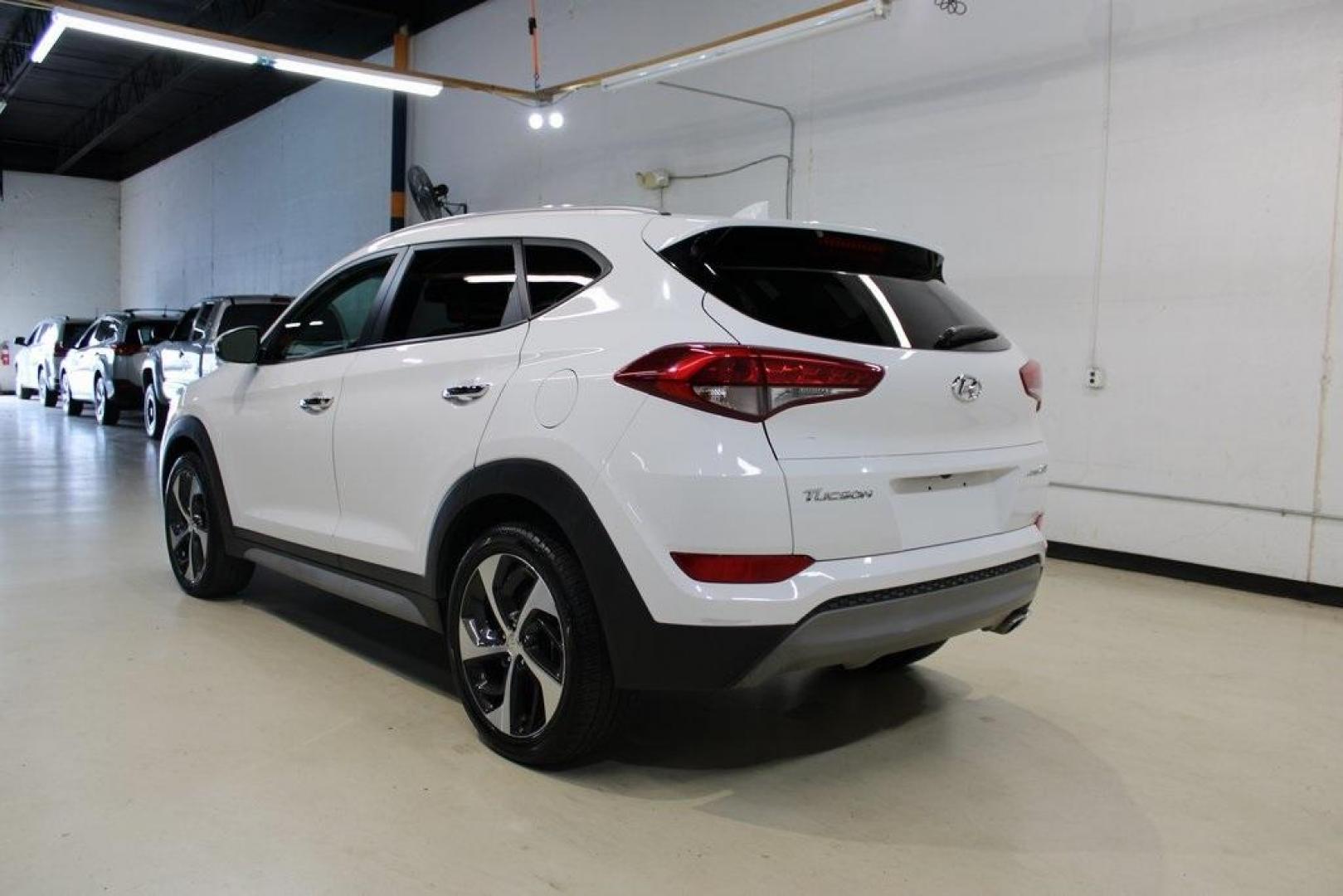 2018 Dazzling White /Beige Hyundai Tucson Limited (KM8J33A28JU) with an 1.6L I4 DGI Turbocharged DOHC 16V ULEV II 175hp engine, Automatic transmission, located at 15300 Midway Rd., Addison, TX, 75001, (972) 702-0011, 32.958321, -96.838074 - Photo#3