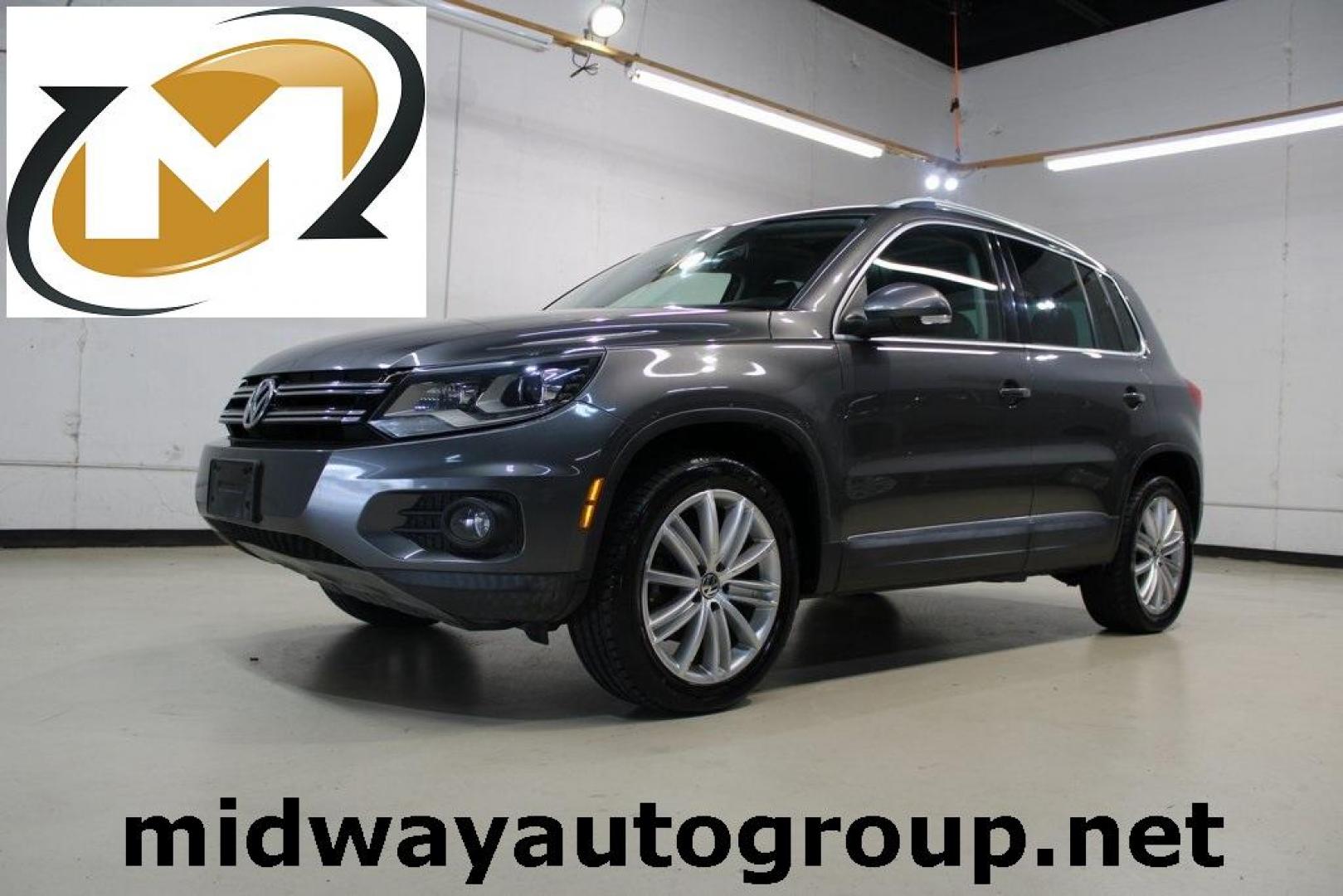 2016 Gray Volkswagen Tiguan SE (WVGAV7AX7GW) with an 2.0L 4-Cylinder Turbocharged engine, Automatic transmission, located at 15300 Midway Rd., Addison, TX, 75001, (972) 702-0011, 32.958321, -96.838074 - Photo#0