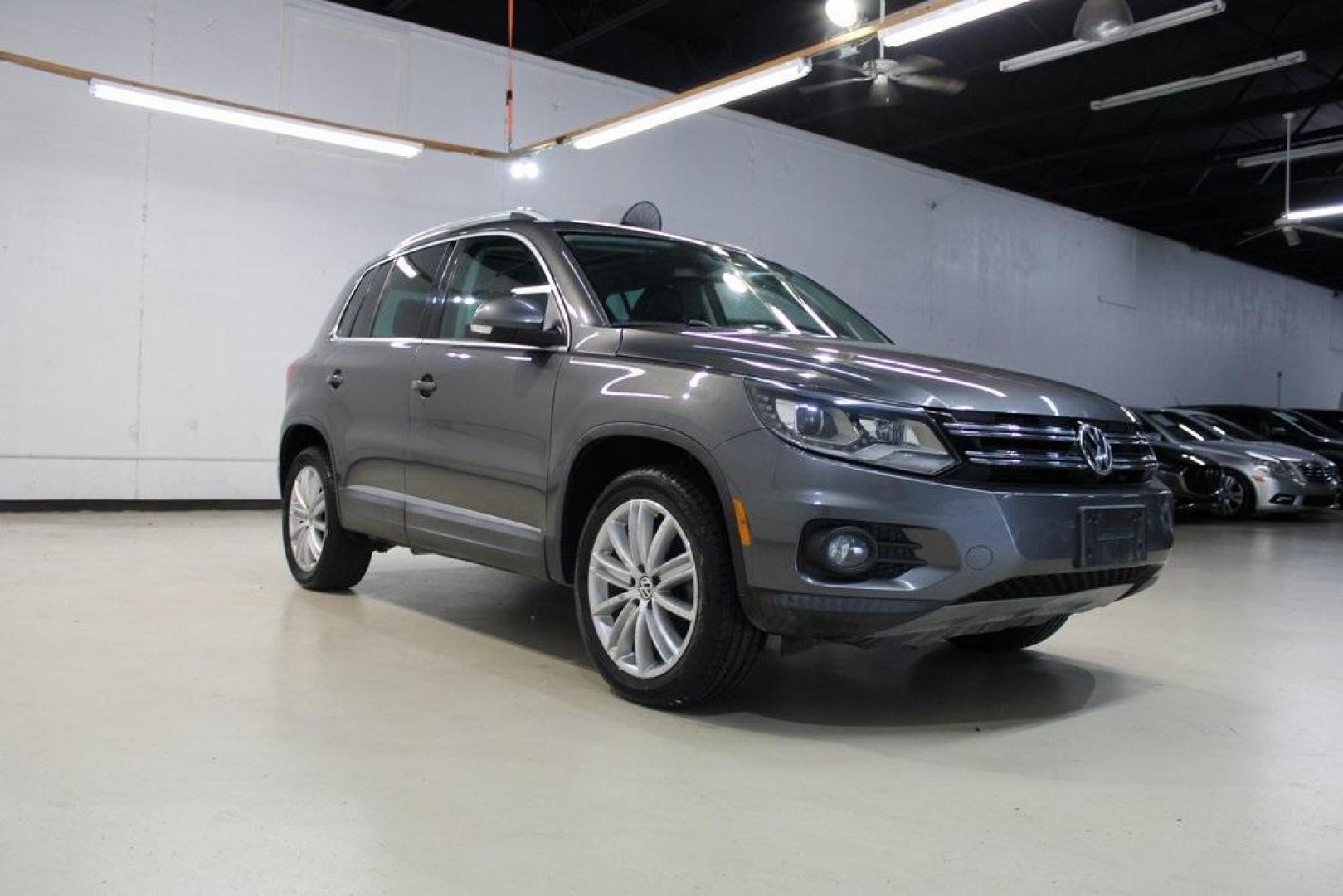 2016 Gray Volkswagen Tiguan SE (WVGAV7AX7GW) with an 2.0L 4-Cylinder Turbocharged engine, Automatic transmission, located at 15300 Midway Rd., Addison, TX, 75001, (972) 702-0011, 32.958321, -96.838074 - Photo#1