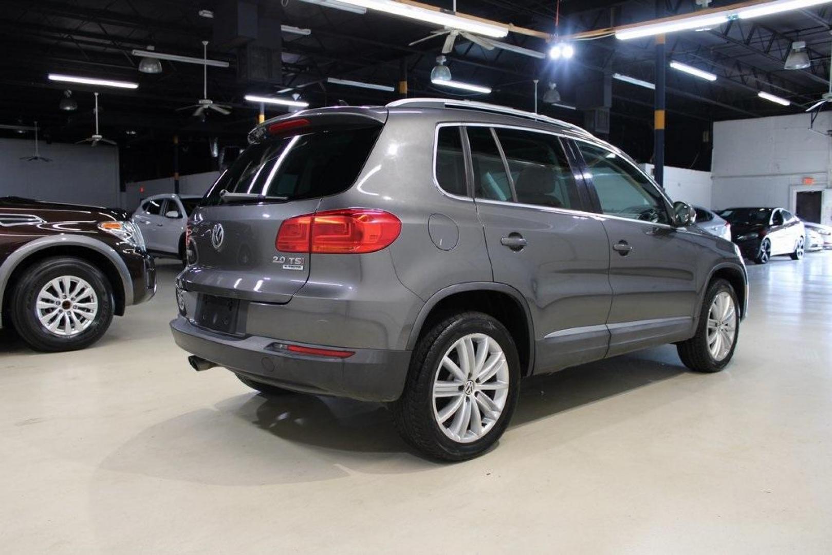 2016 Gray Volkswagen Tiguan SE (WVGAV7AX7GW) with an 2.0L 4-Cylinder Turbocharged engine, Automatic transmission, located at 15300 Midway Rd., Addison, TX, 75001, (972) 702-0011, 32.958321, -96.838074 - Photo#2