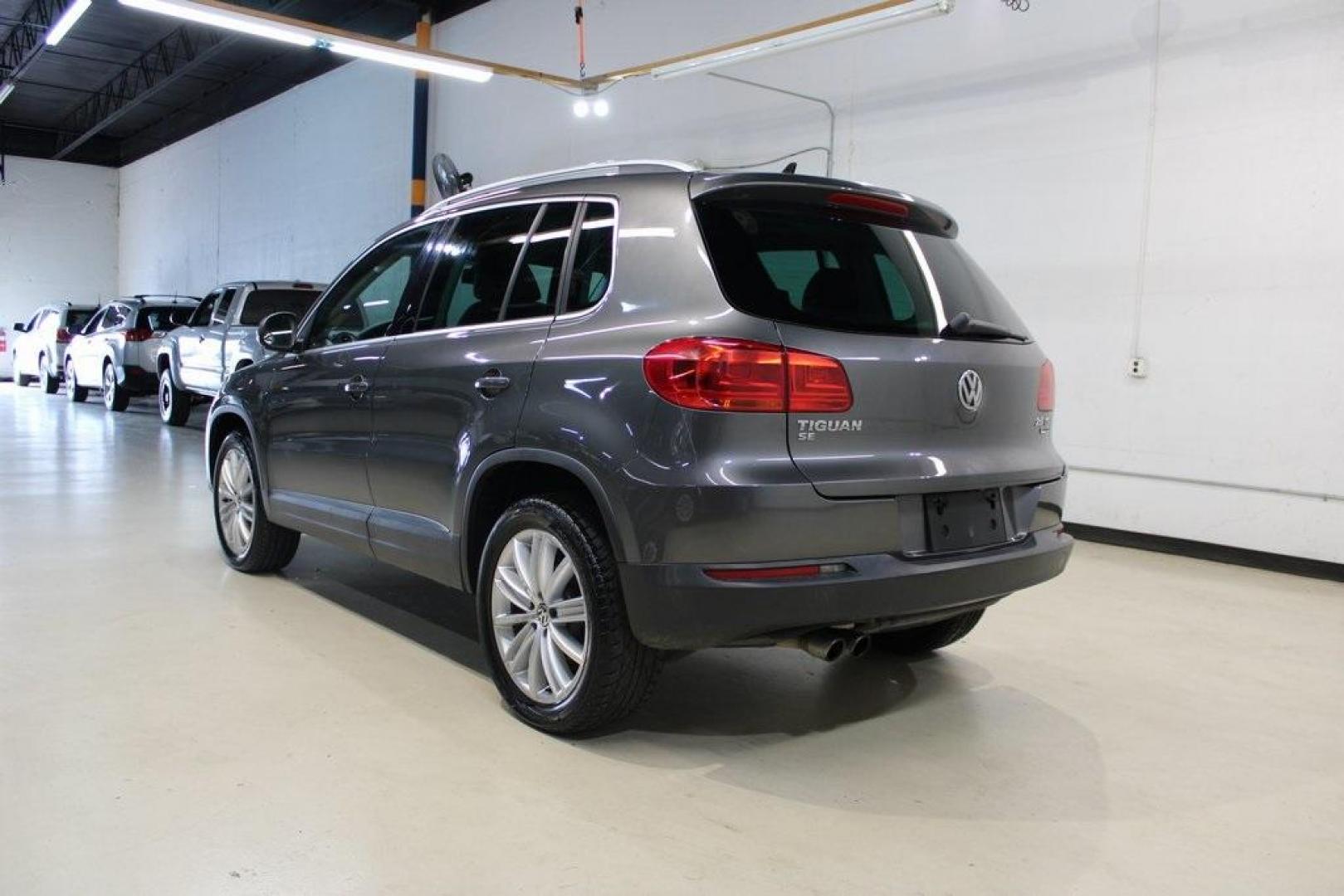 2016 Gray Volkswagen Tiguan SE (WVGAV7AX7GW) with an 2.0L 4-Cylinder Turbocharged engine, Automatic transmission, located at 15300 Midway Rd., Addison, TX, 75001, (972) 702-0011, 32.958321, -96.838074 - Photo#3