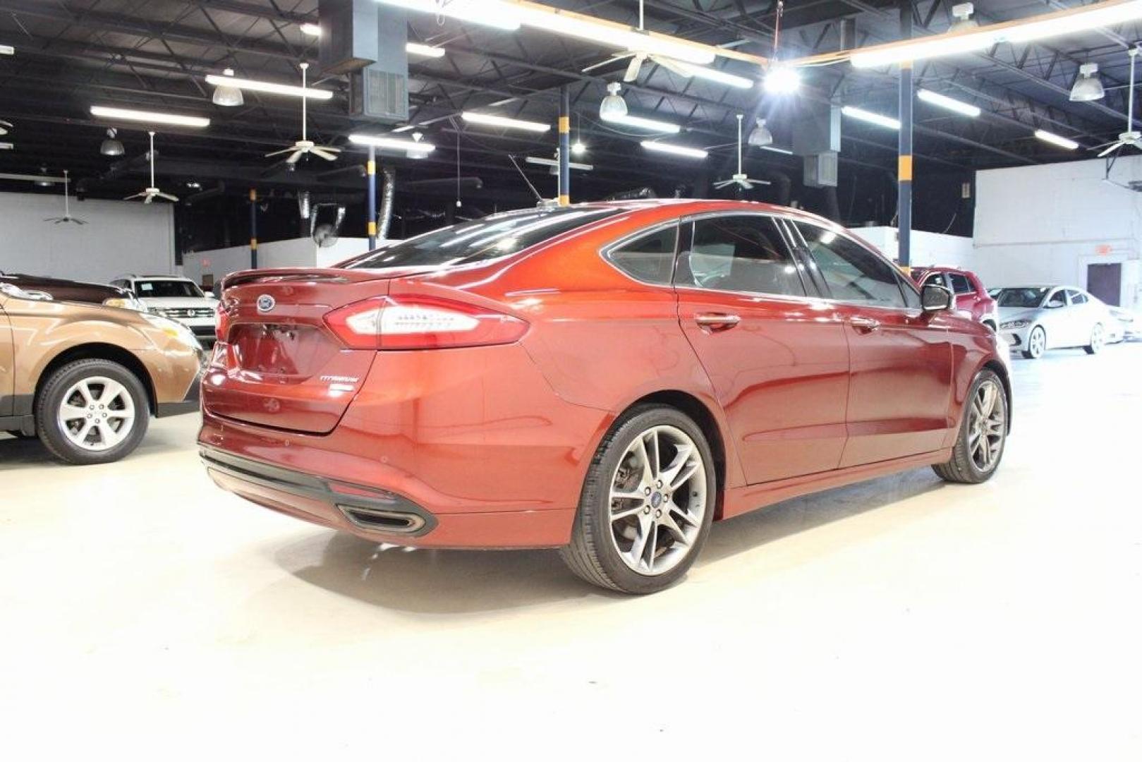 2014 Sunset Metallic /Charcoal Black Ford Fusion Titanium (3FA6P0K97ER) with an EcoBoost 2.0L I4 GTDi DOHC Turbocharged VCT engine, Automatic transmission, located at 15300 Midway Rd., Addison, TX, 75001, (972) 702-0011, 32.958321, -96.838074 - HOME OF THE NO HAGGLE PRICE - WHOLESALE PRICES TO THE PUBLIC!! Fusion Titanium, 4D Sedan, EcoBoost 2.0L I4 GTDi DOHC Turbocharged VCT, 6-Speed Automatic, FWD, Orange, Leather.<br><br>Orange 2014 Ford Fusion Titanium<br><br>22/33 City/Highway MPG<br><br>Awards:<br> * 2014 IIHS Top Safety Pick+ * 2 - Photo#1